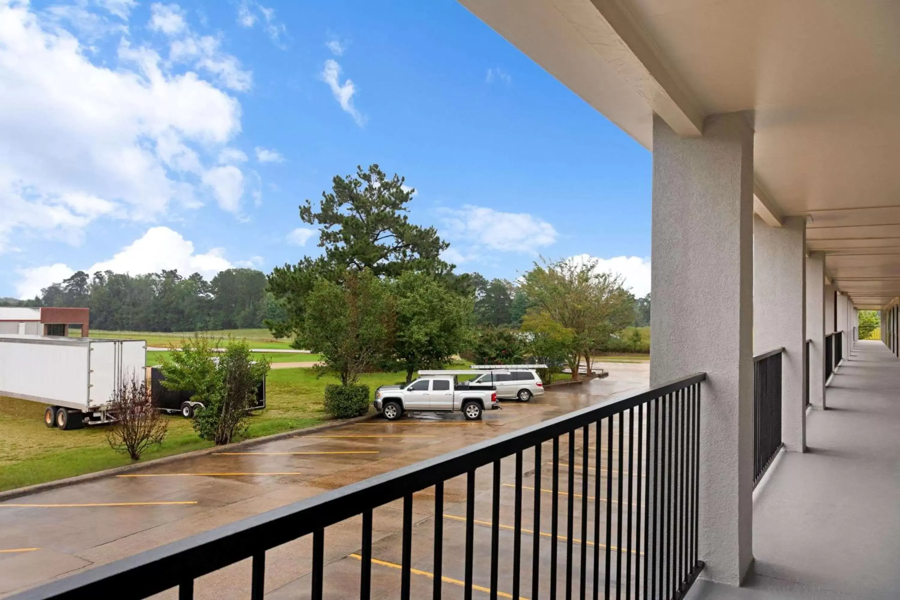 Property building, Balcony/Terrace in Super 8 by Wyndham Brookhaven