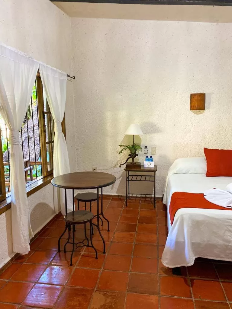 Bed in Hotel Maya Bell