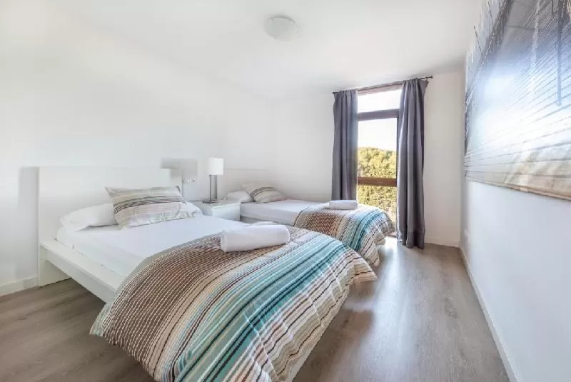 Bed in Agaró Cambrils Apartments