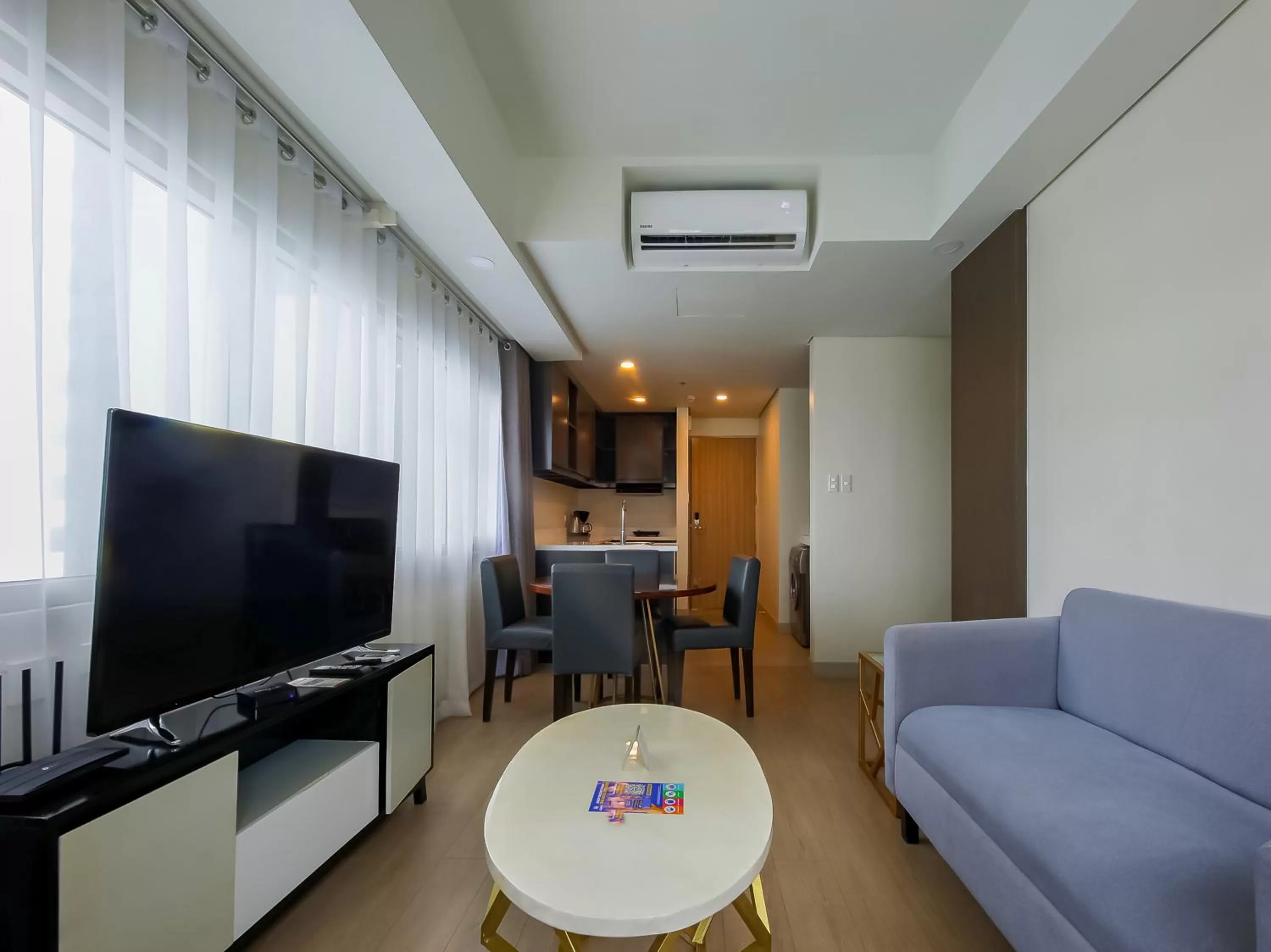 Living room, TV/Entertainment Center in Capital O 804 The Residences at Bonifacio Civic Center