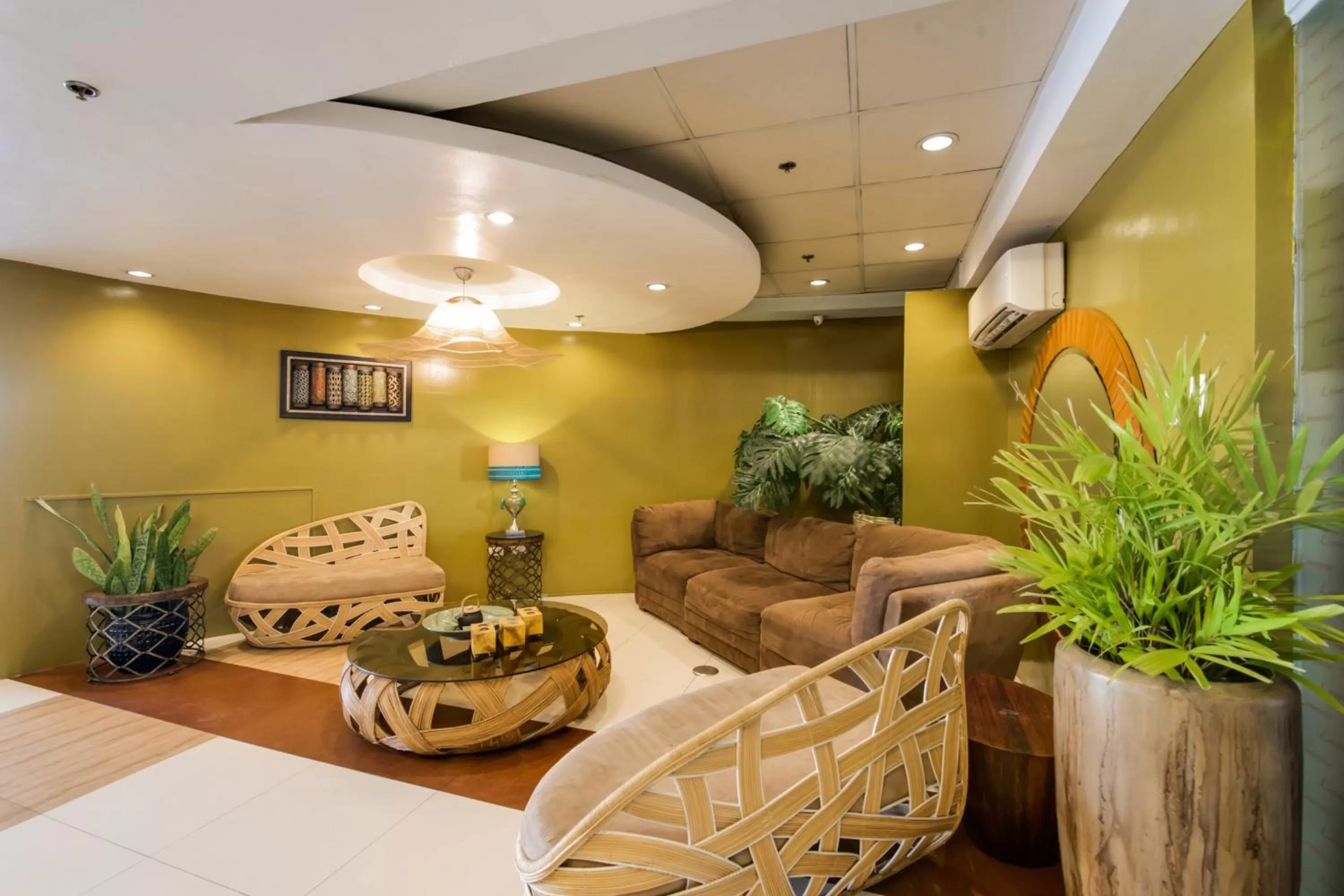 Seating area, Bed in Festive Hotel Makati