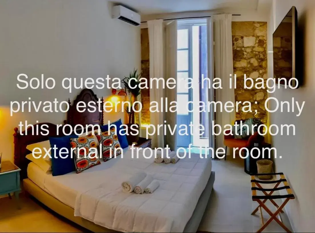 Bedroom, Property Logo/Sign in Calamùrn Ortigia