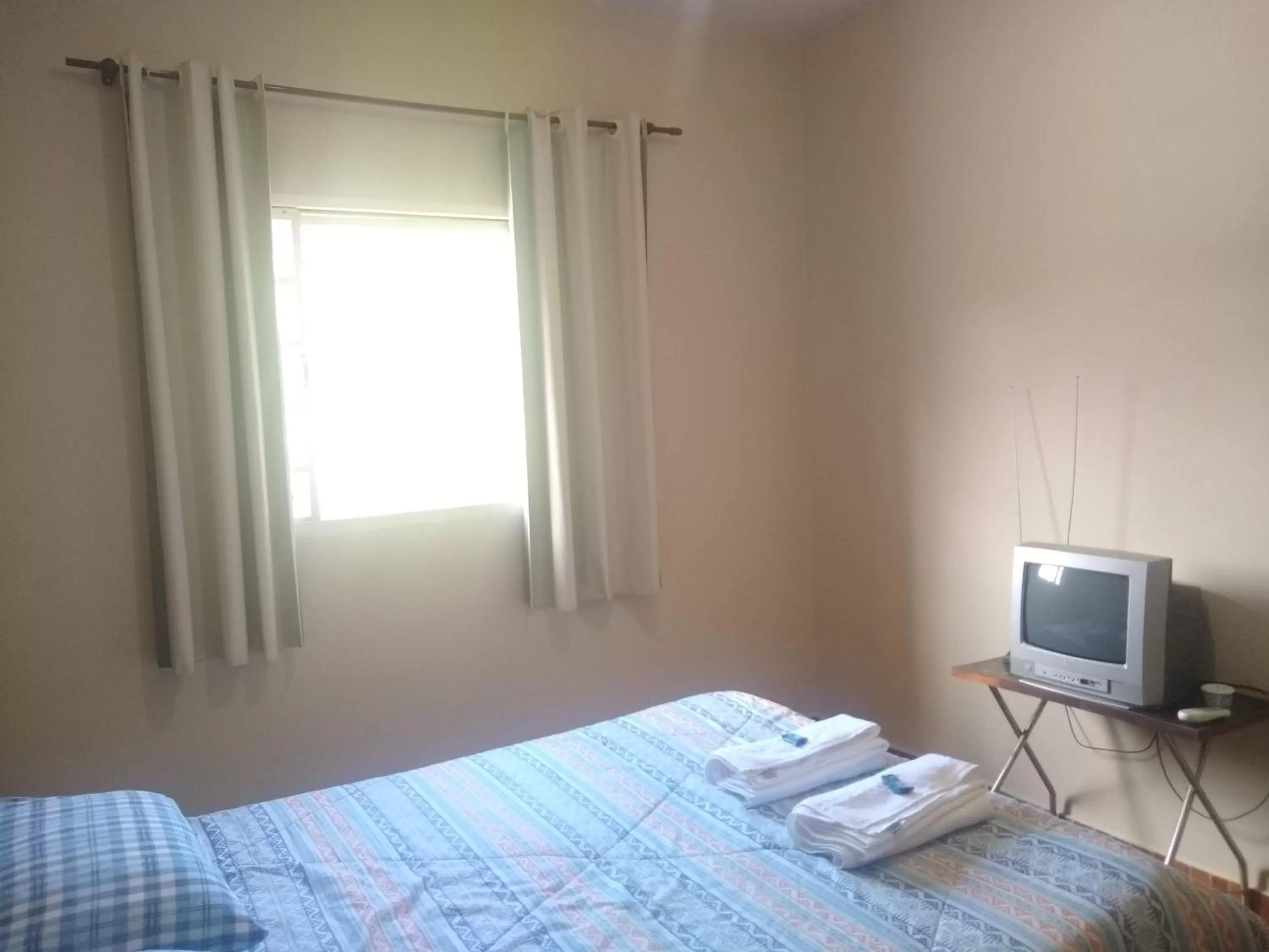 Bed in Pousada do Ribeirão