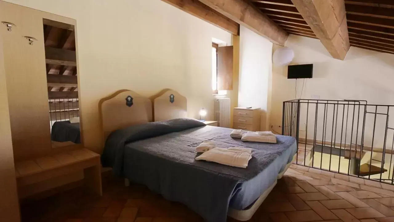 Bed in Borgo de' Varano by Hotel I Duchi