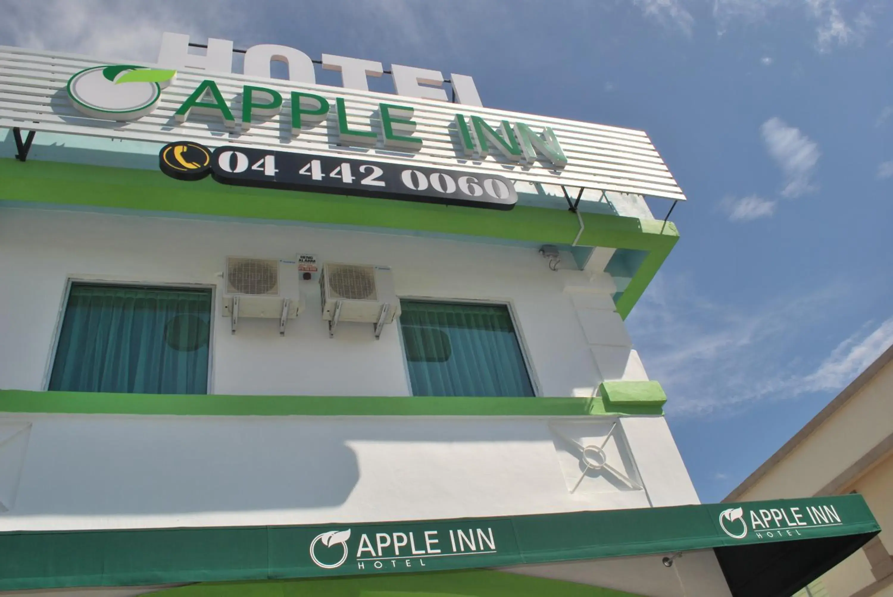 Property logo or sign in Apple Inn Hotel