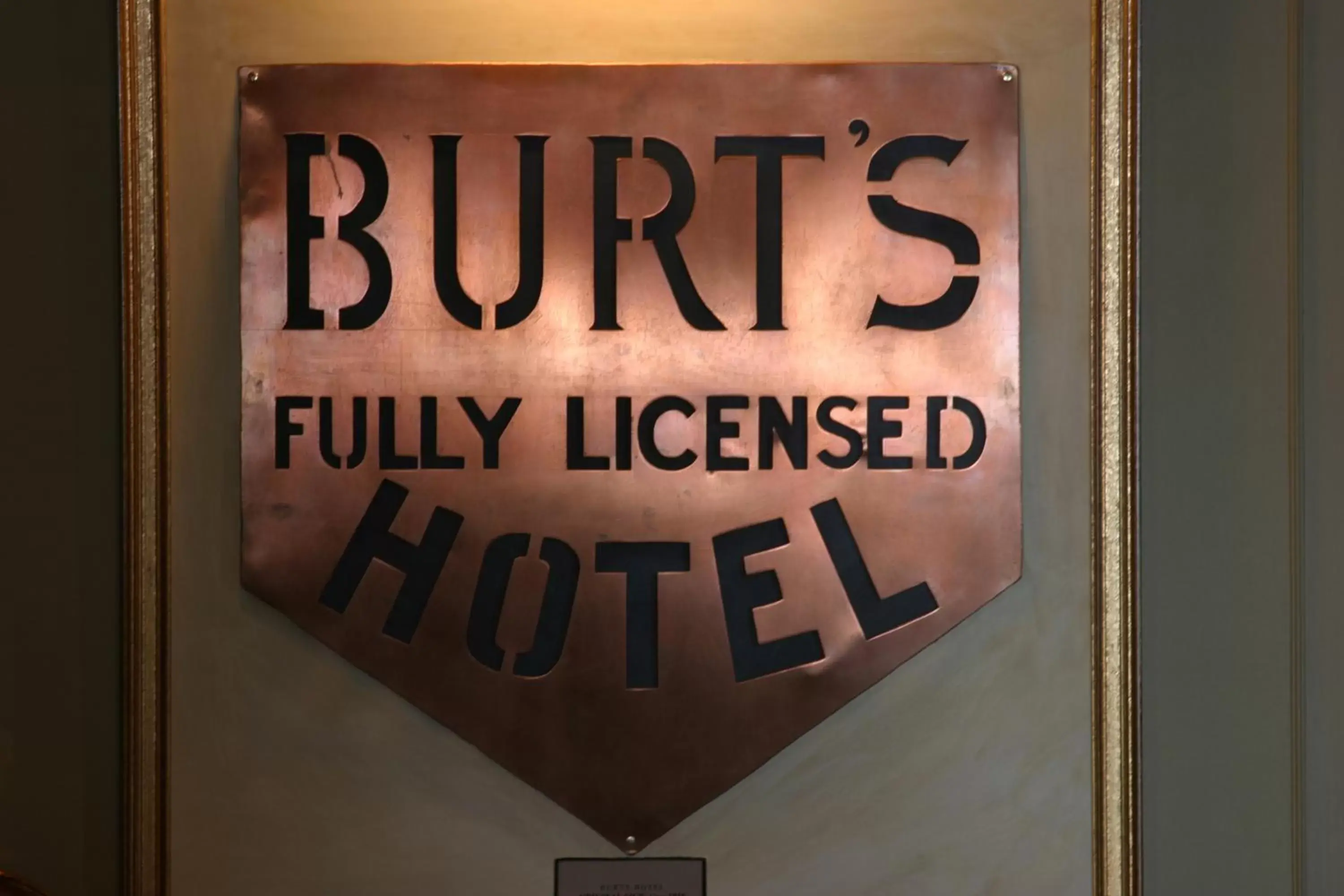 Property logo or sign in Burt's Hotel