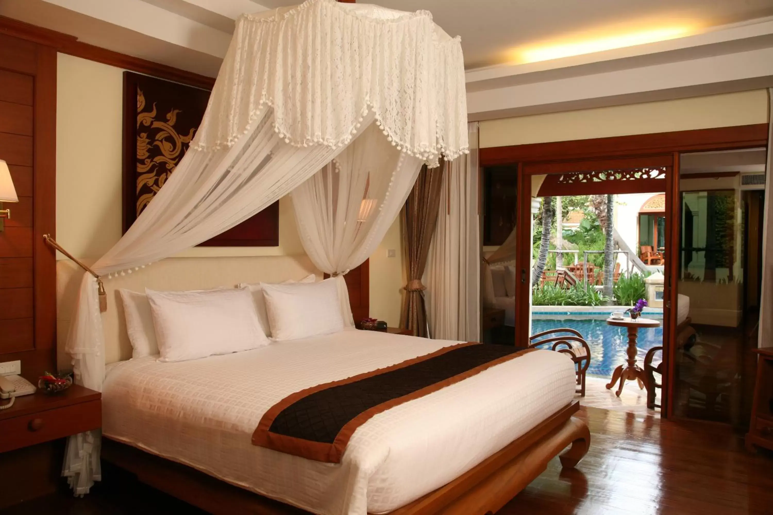 Photo of the whole room, Bed in Centara Khum Phaya Resort & Spa, Centara Boutique Collection