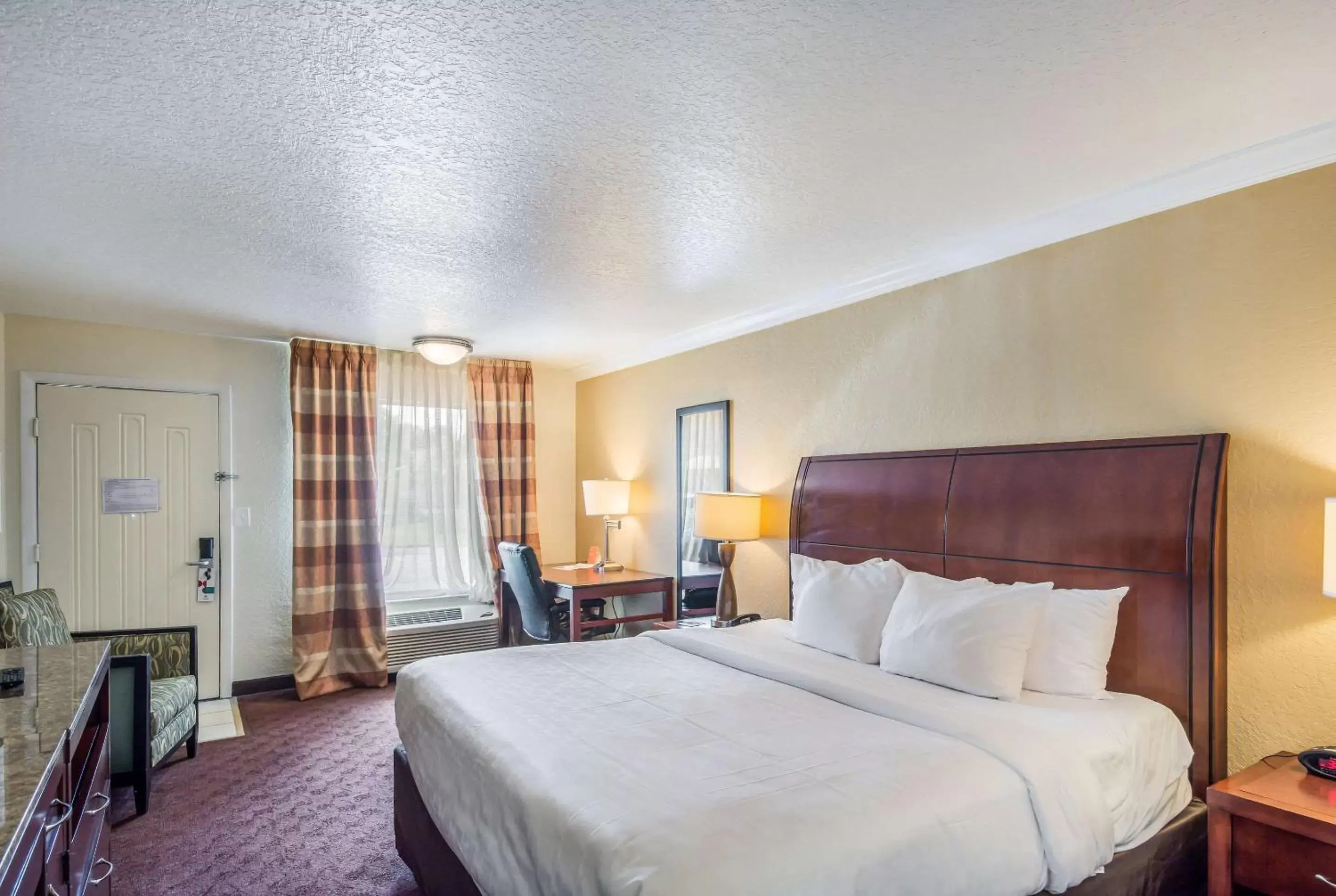 Photo of the whole room, Bed in Clarion Inn & Suites Central Clearwater Beach