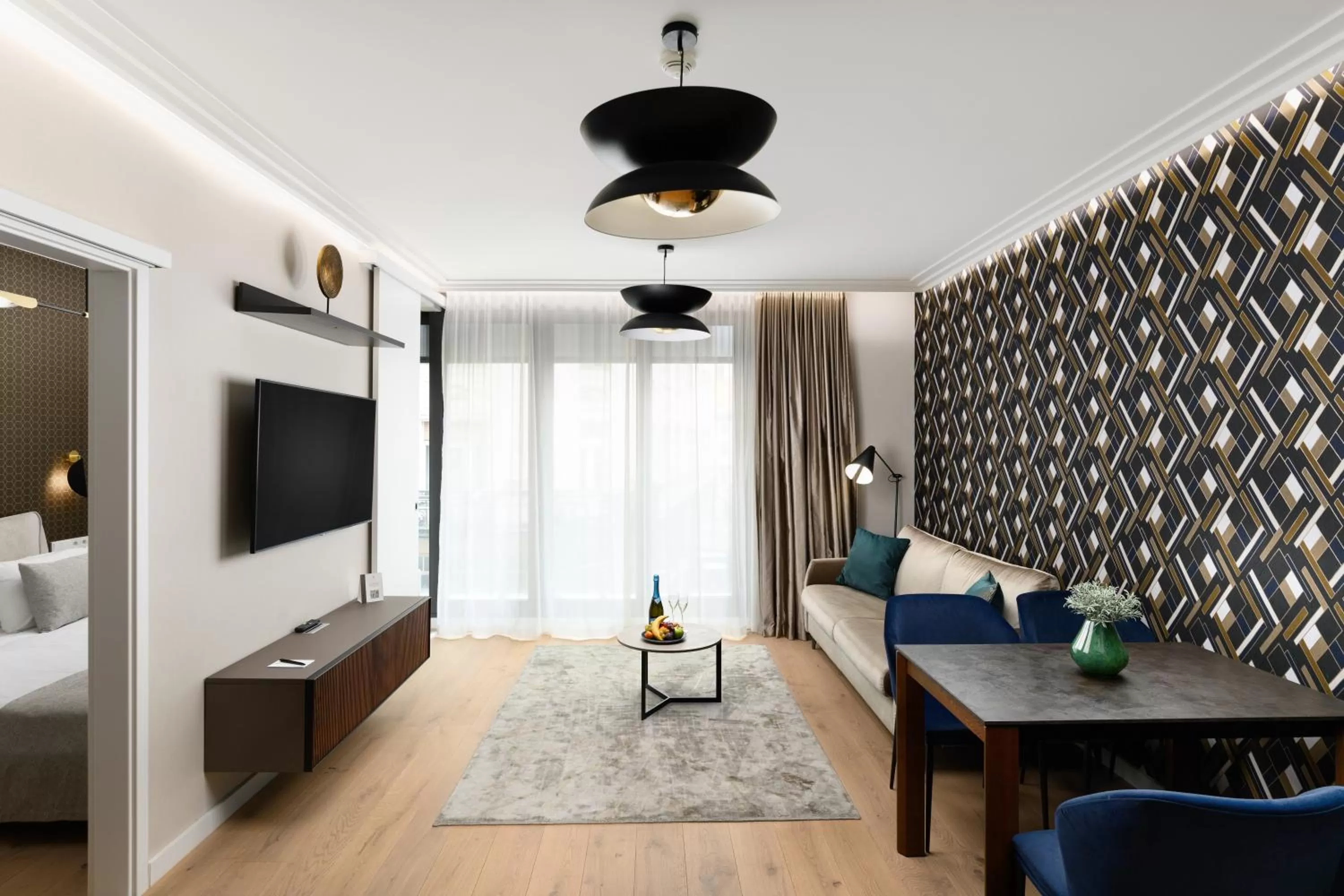 Living room, Bed in Emerald Downtown Luxury Suites by Continental Group