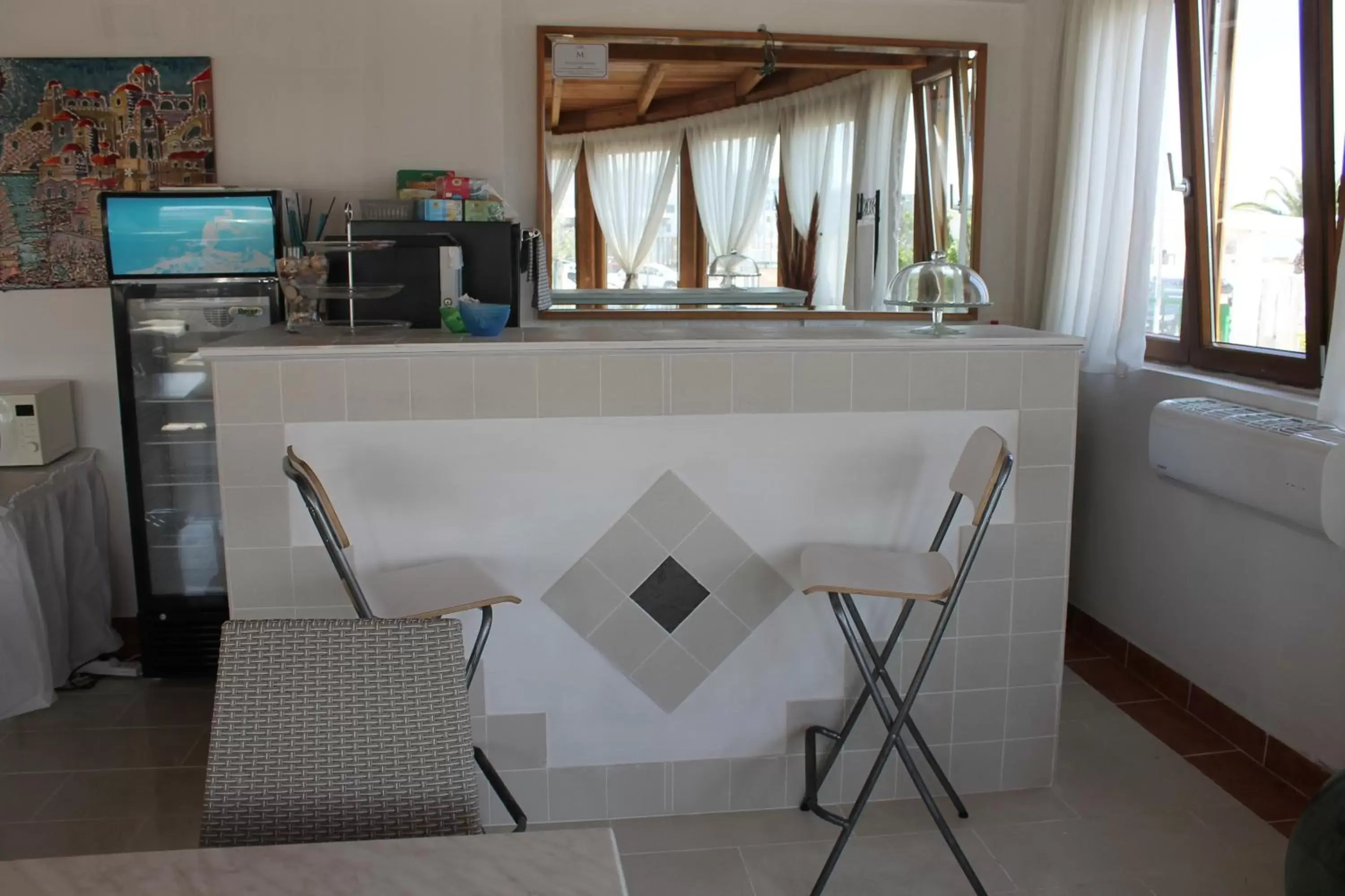 Lounge or bar, Kitchen/Kitchenette in B&B Palazzo Manfredi Vieste vista mare con Parcheggio