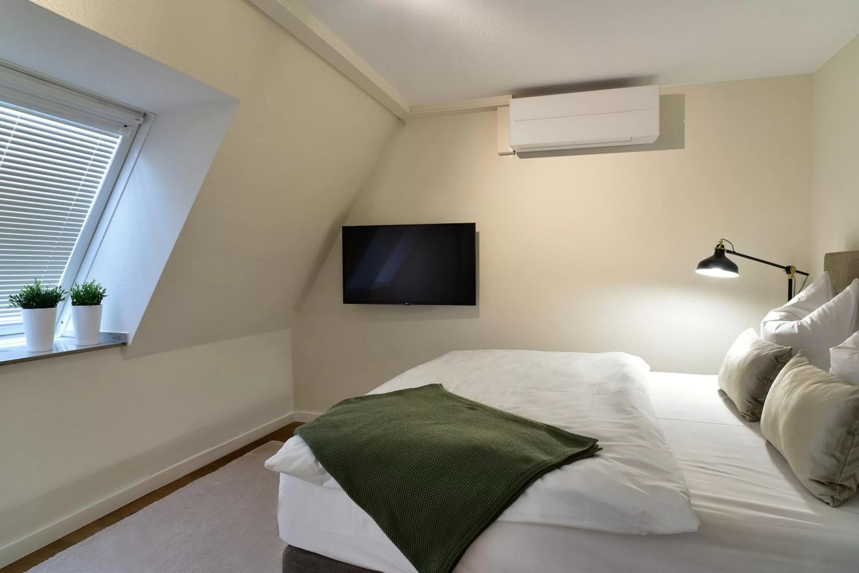 Bedroom, Bed in SAXX Apartments Leipzig