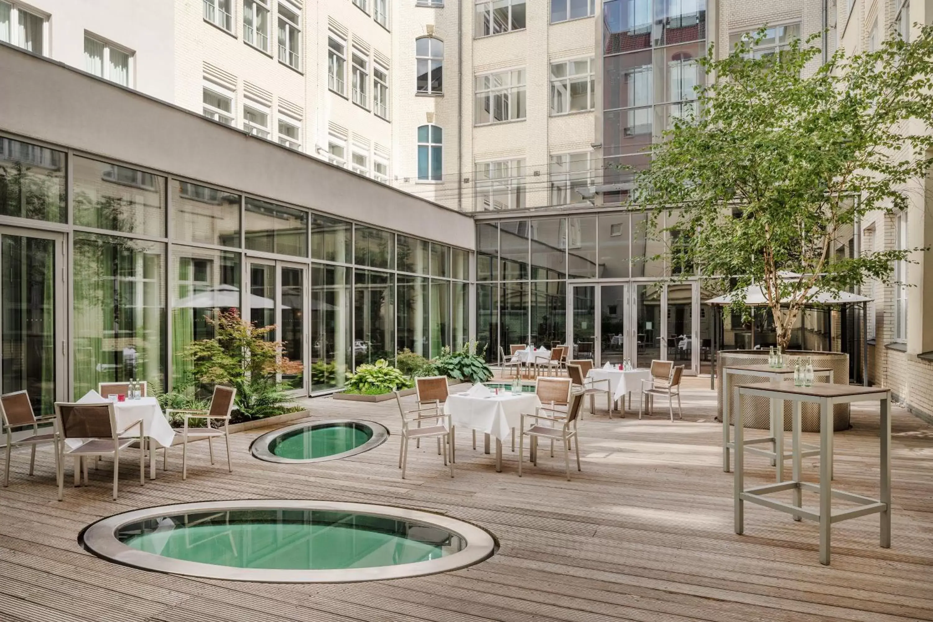 Patio, Swimming Pool in Mövenpick Hotel Berlin Am Potsdamer Platz