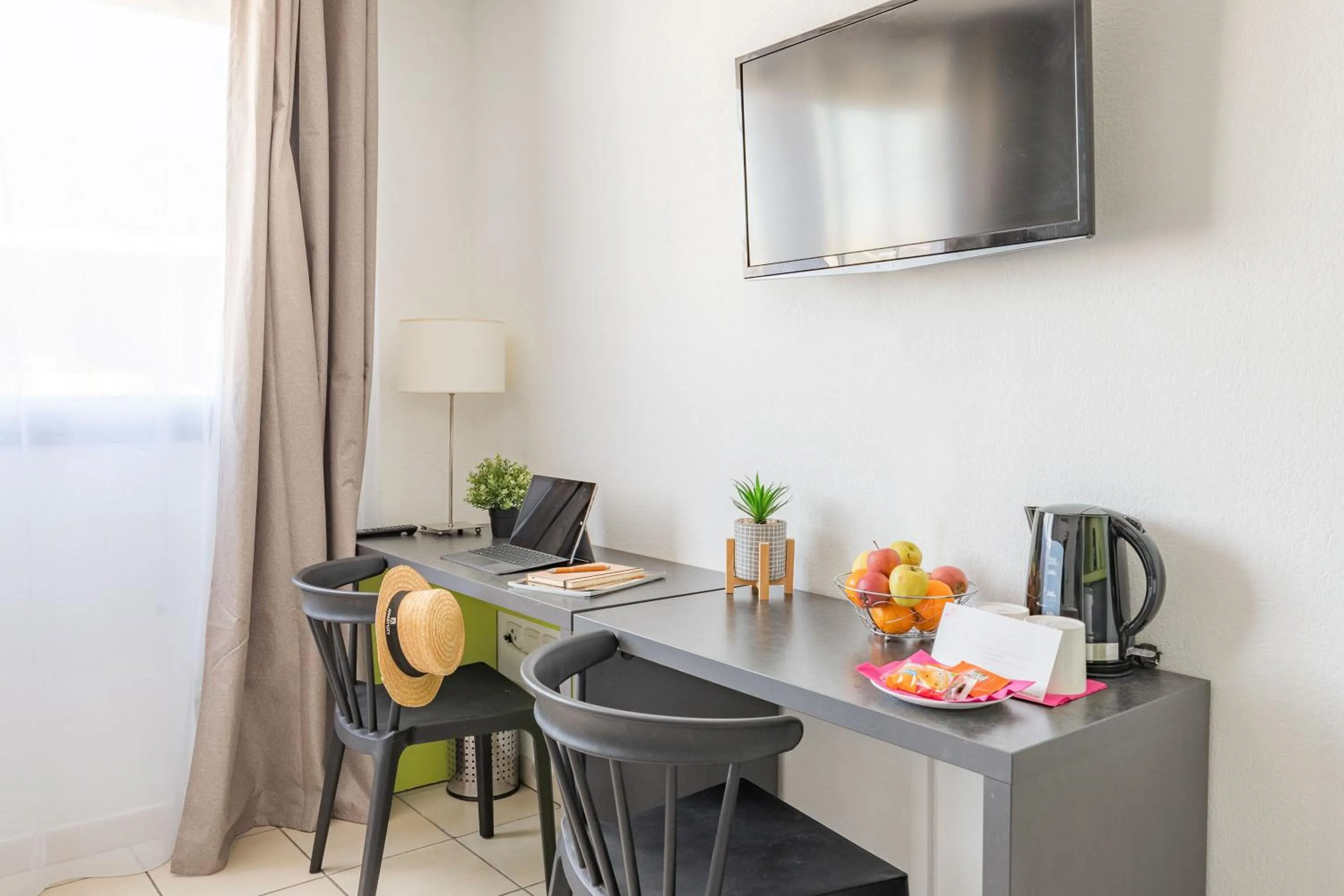 TV and multimedia in Appart'City Confort La Ciotat - Côté Port