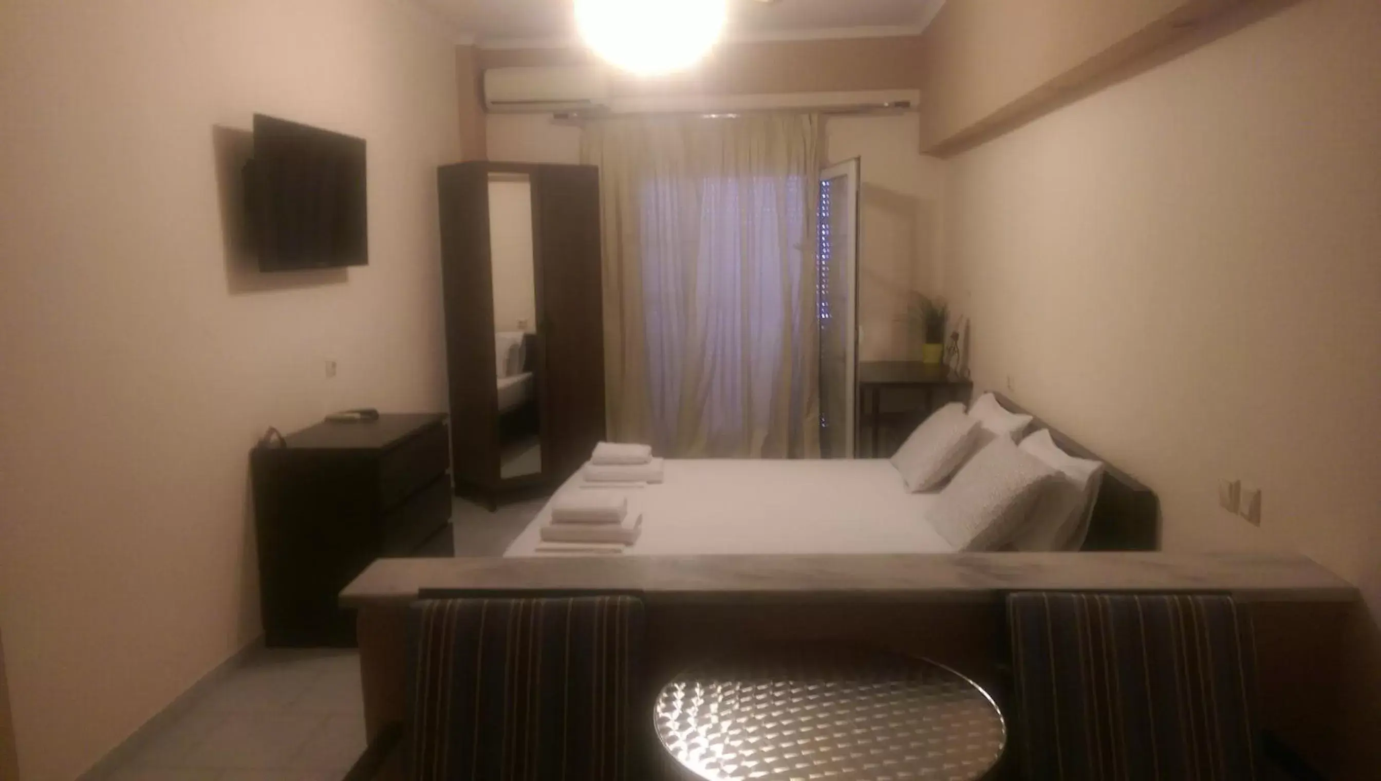 Bedroom, TV/Entertainment Center in Alexandros Hotel
