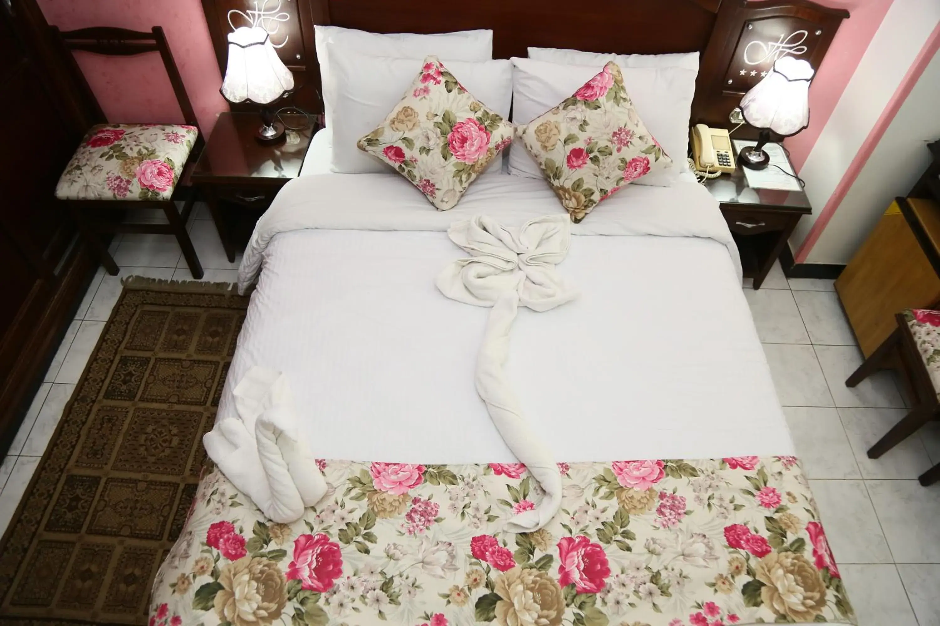 Bed in Happy City Hotel
