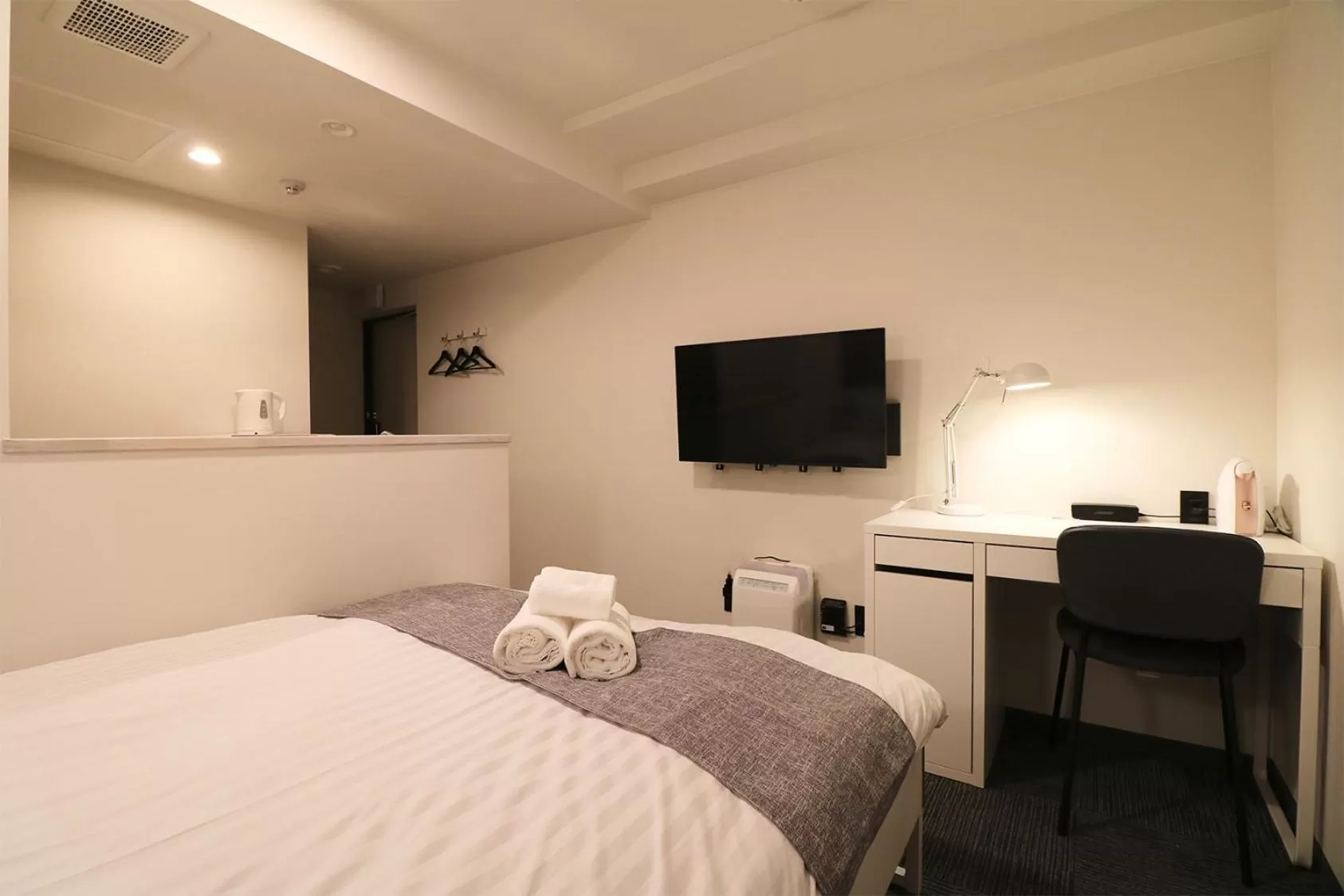 Bed in TAKETO STAY PREMIERE SAPPORO Eki