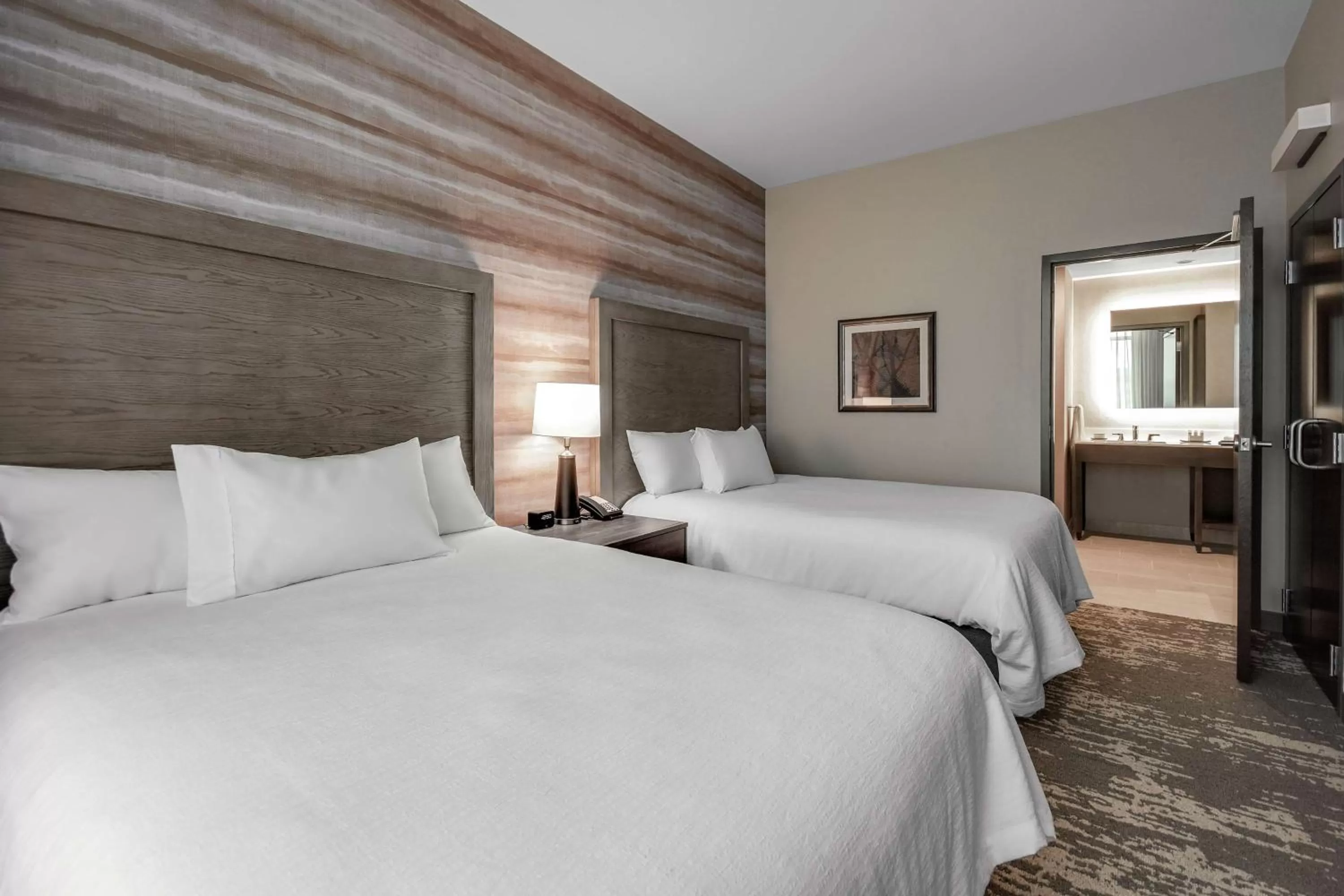 Photo of the whole room, Bed in Embassy Suites by Hilton Jonesboro Red Wolf Convention Center