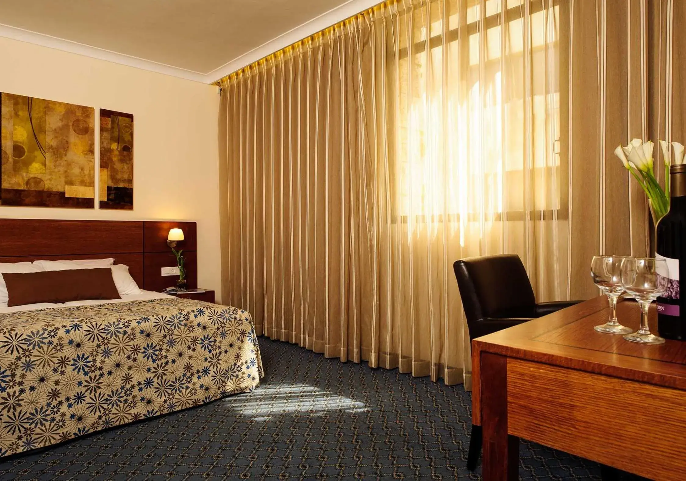 Bed in Caesar Premier Jerusalem Hotel