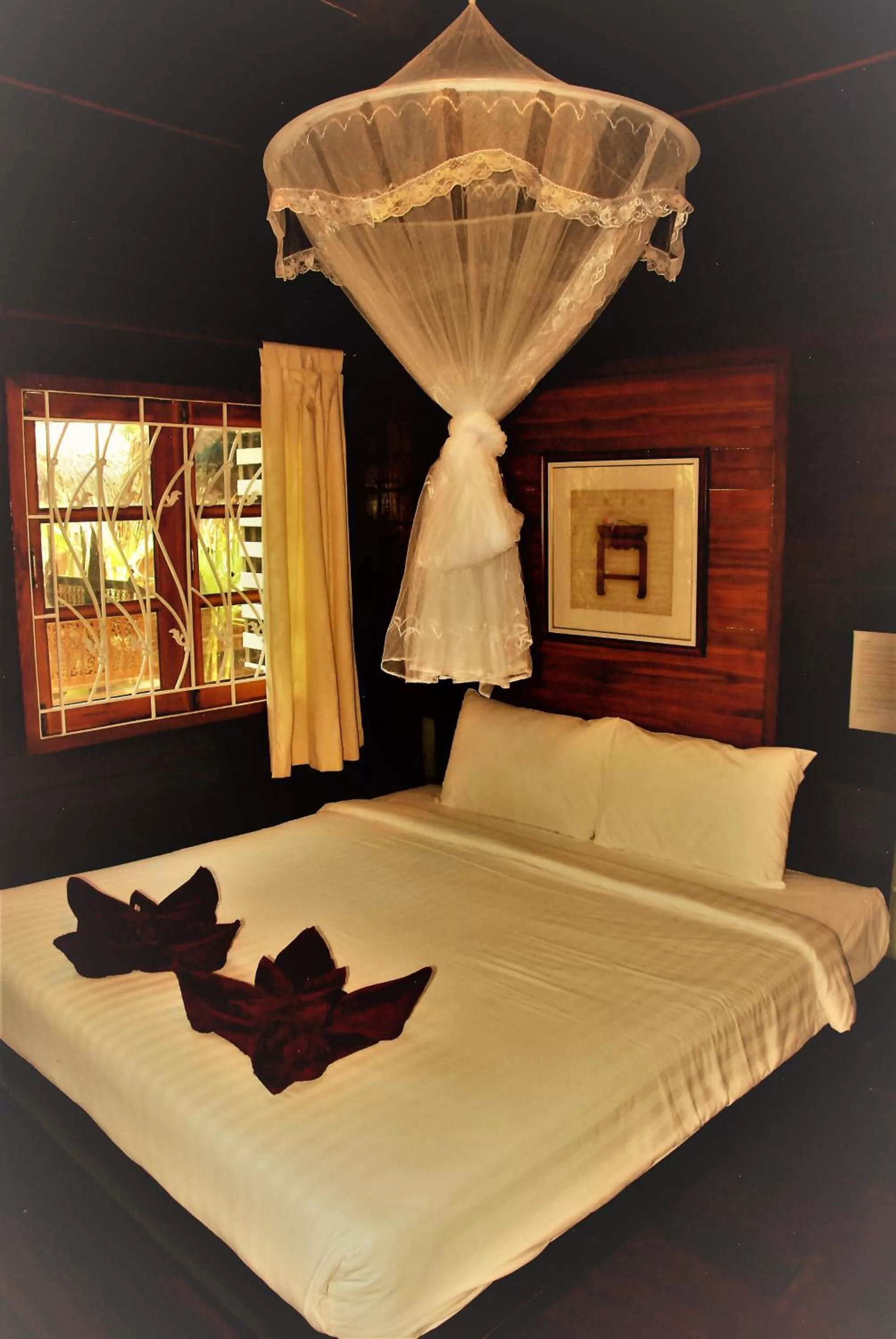 Bed in Cozy Garden Resort