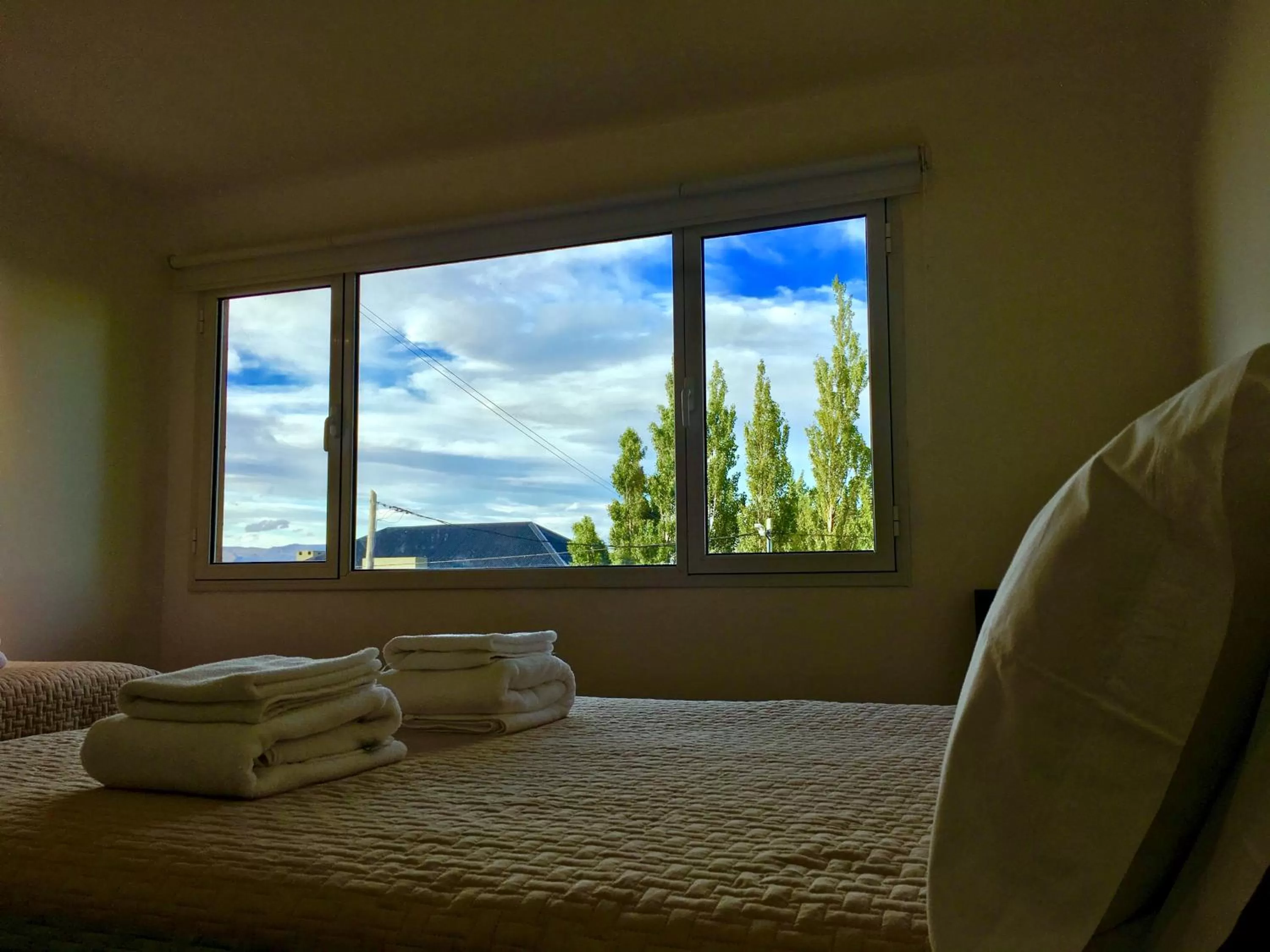 Day, Bed in Flamenco Bay Apartments