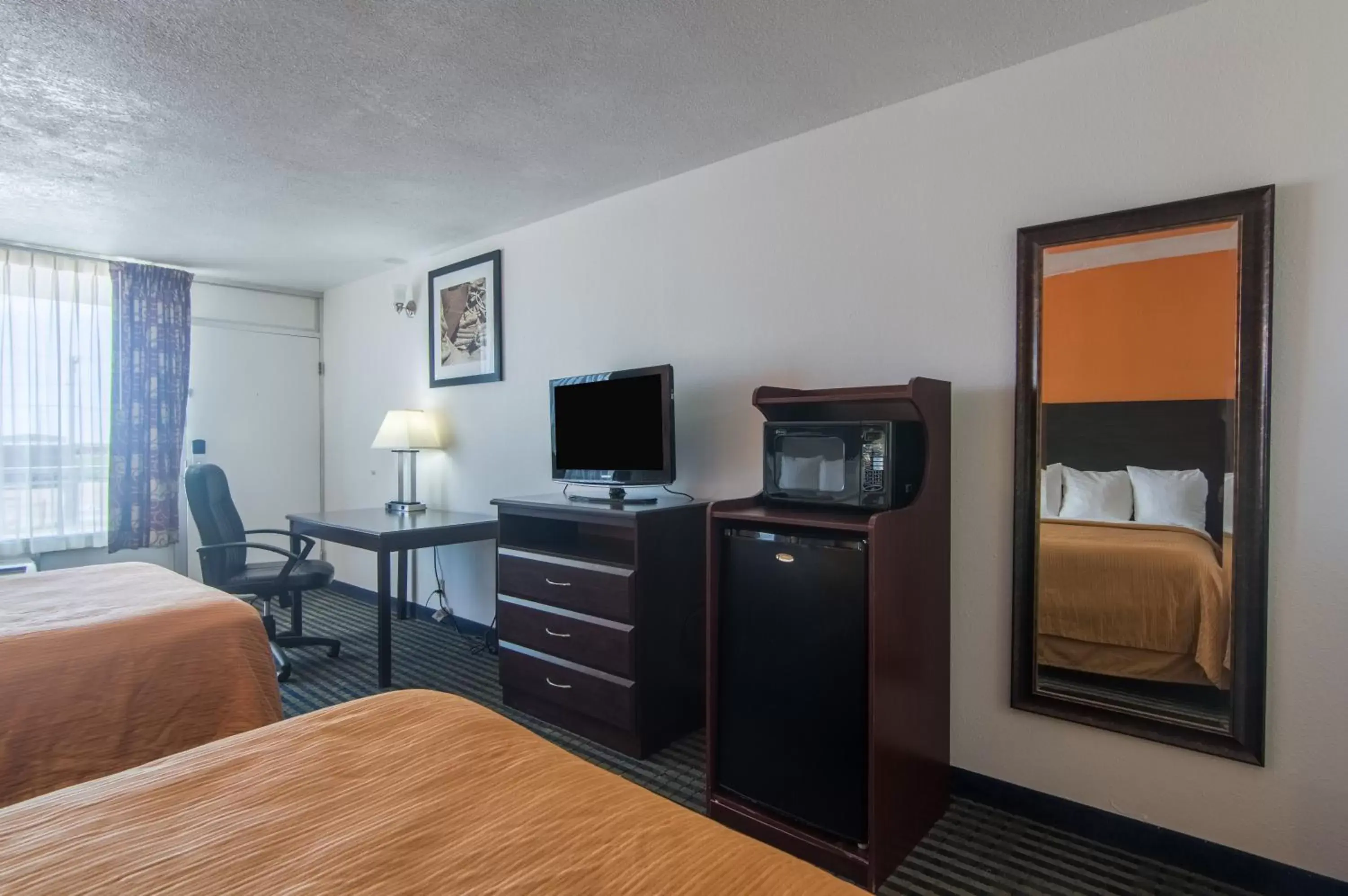 Bedroom, TV/Entertainment Center in Motel 6-Liberal, KS