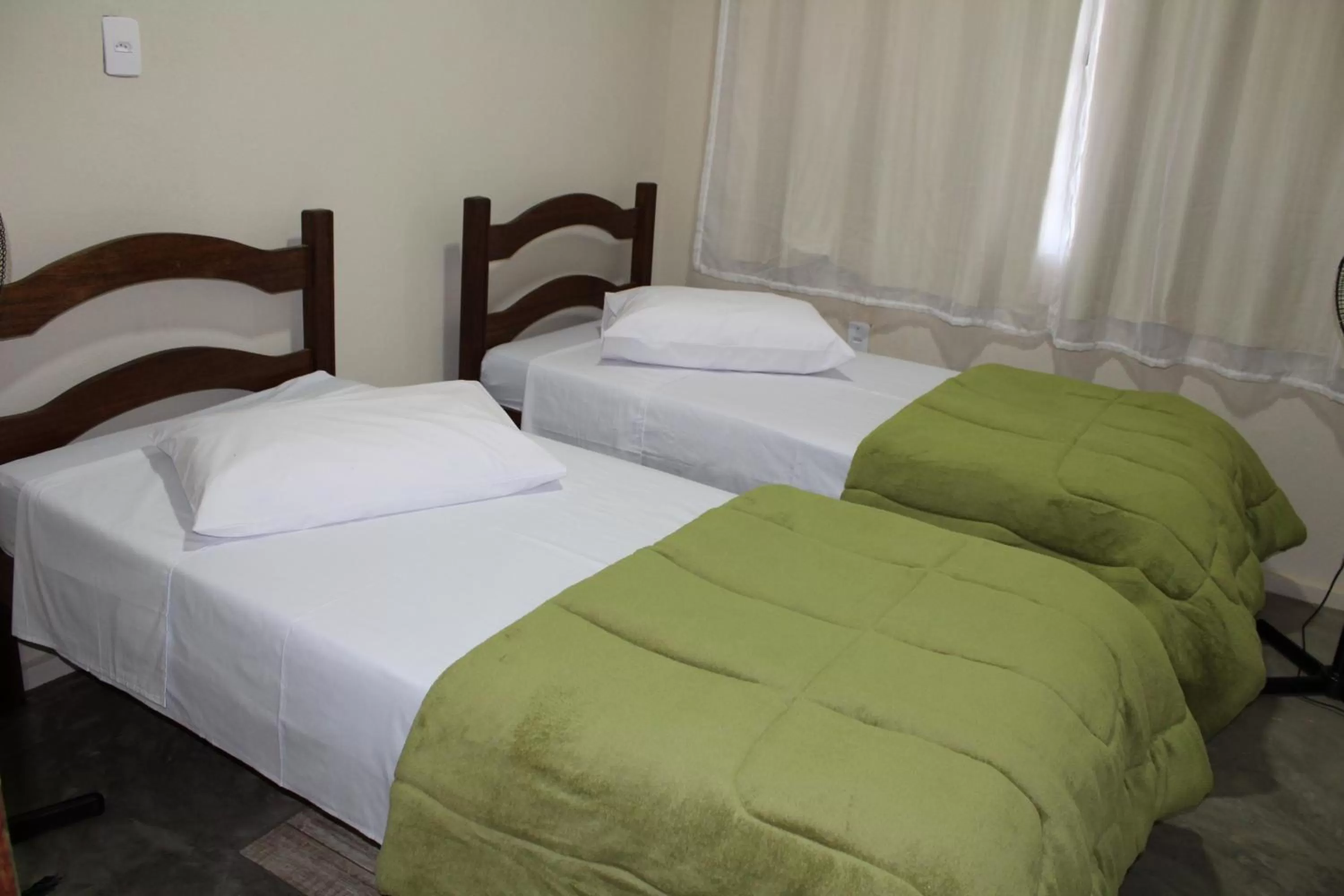 Bed in Pousada Morro dos Ventos