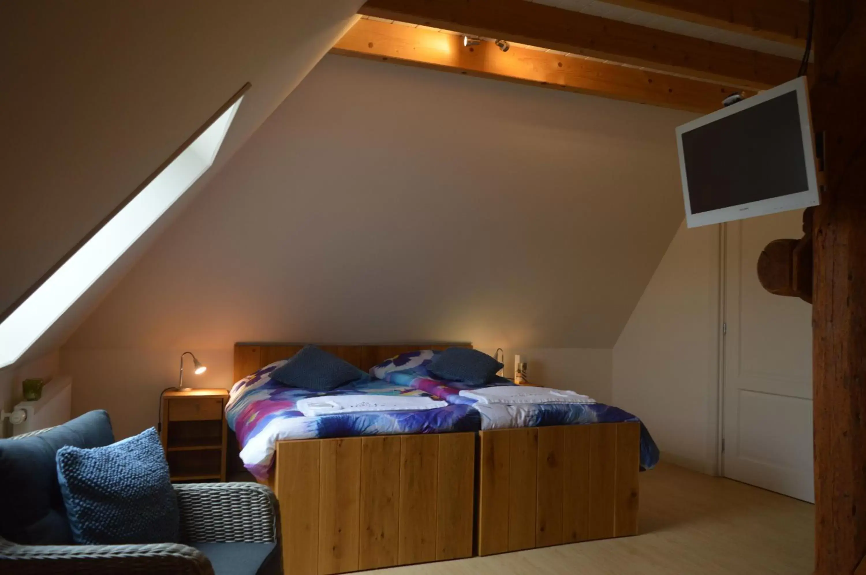 Bed in B&B Idylle aan Zee incl 2 Wellnessstudios