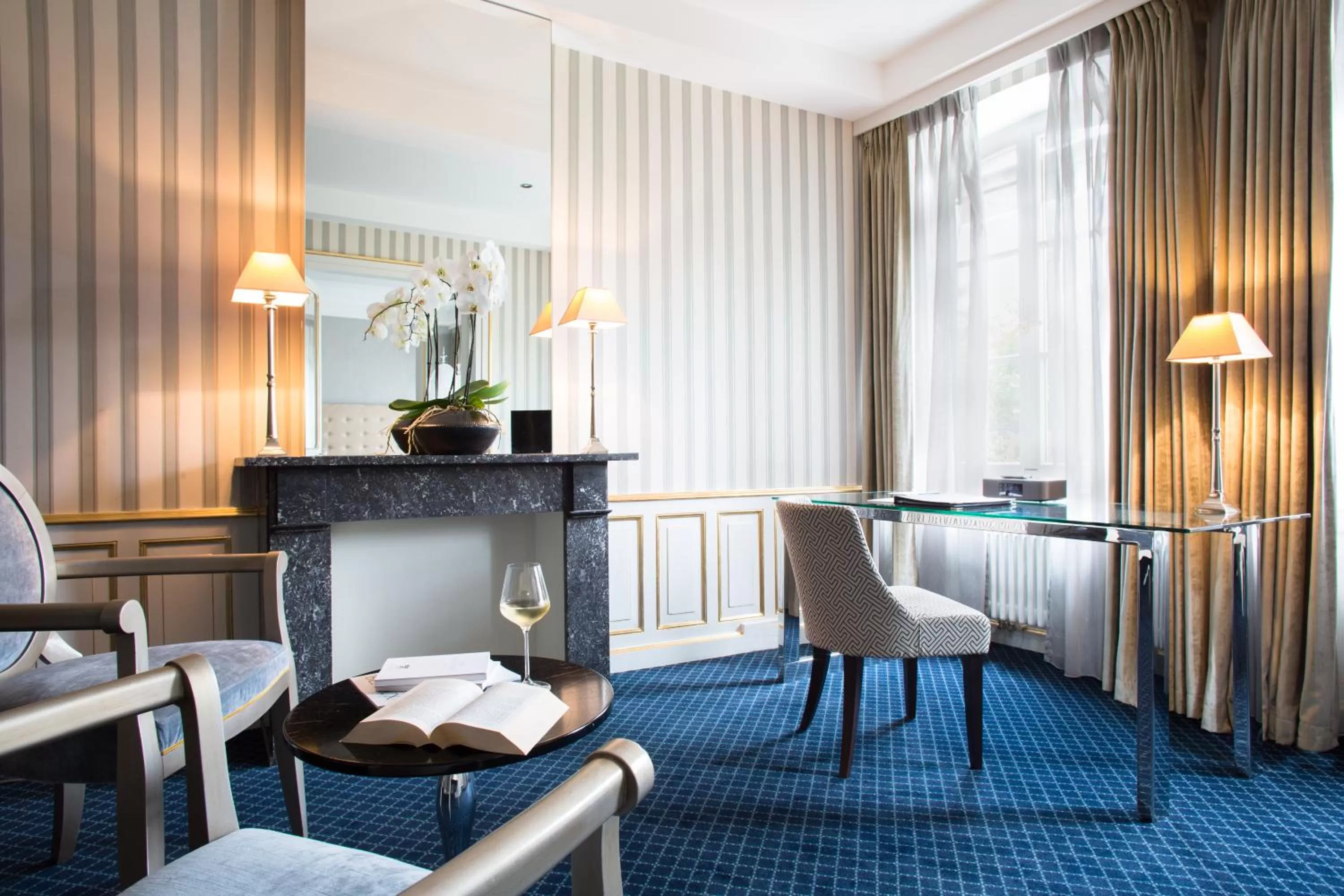 Seating area in Hotel Le Place d'Armes - Relais & Châteaux