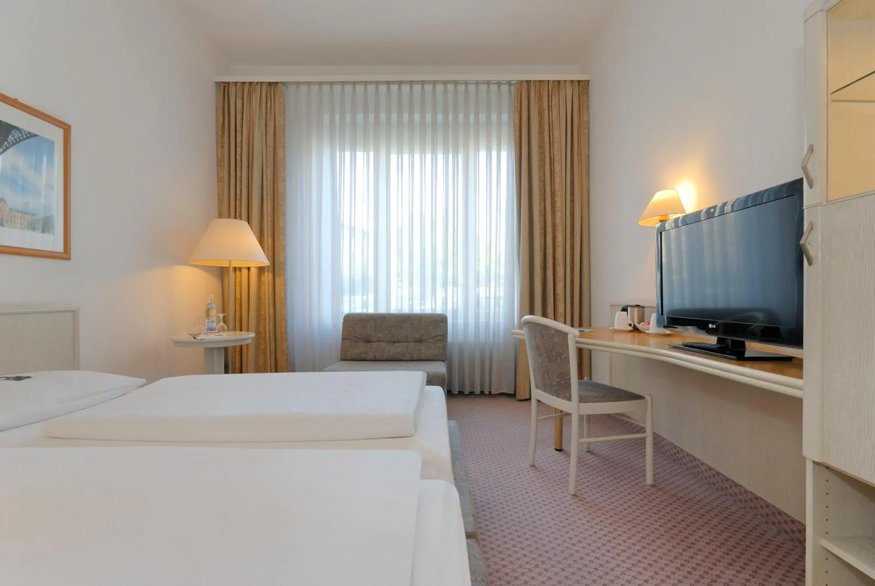 Photo of the whole room, Bed in Hotel Stuttgart Sindelfingen City by Tulip Inn