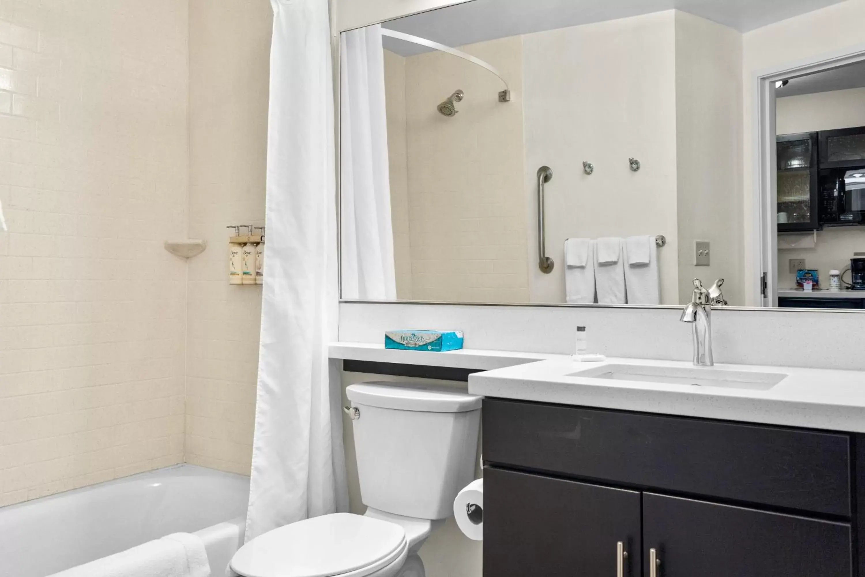 Toilet, Bathroom in Candlewood Suites Erie, an IHG Hotel