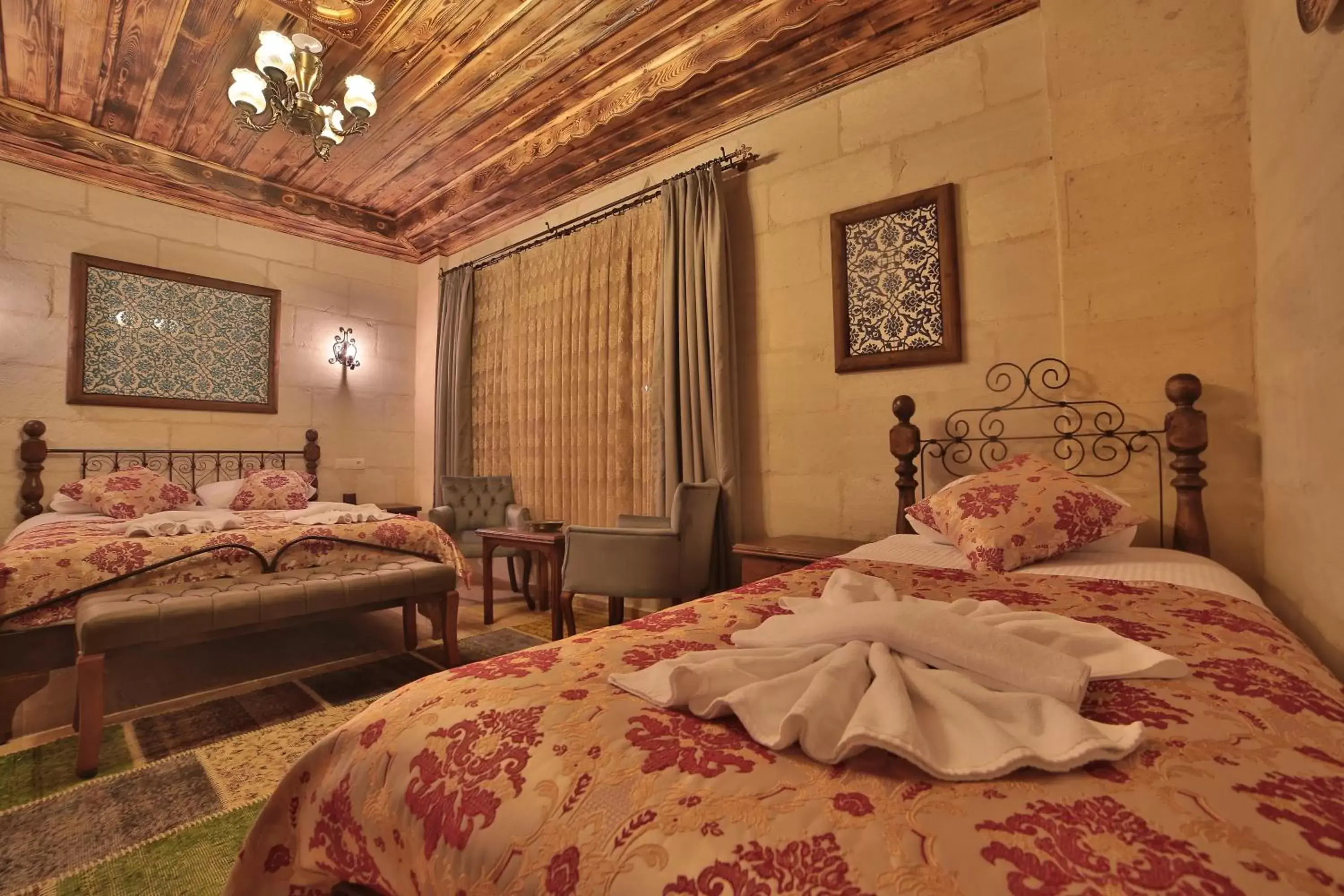 Bed in Caravanserai Inn Hotel