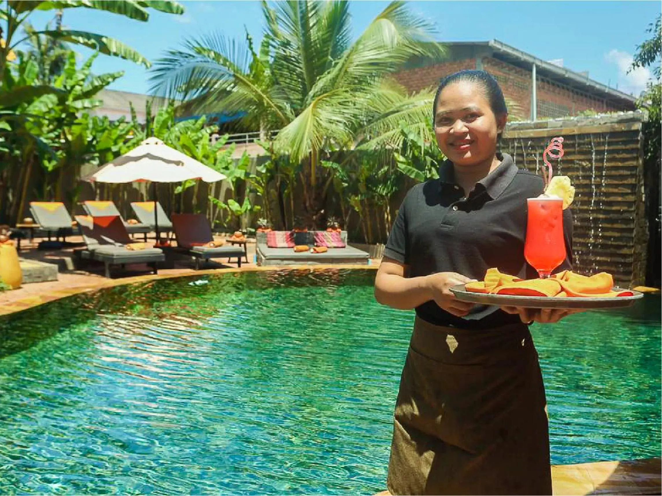 Staff, Swimming Pool in Central Indochine D'angkor Hotel