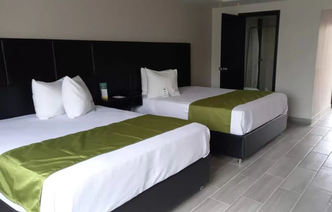 Bed in Hotel Siesta Real