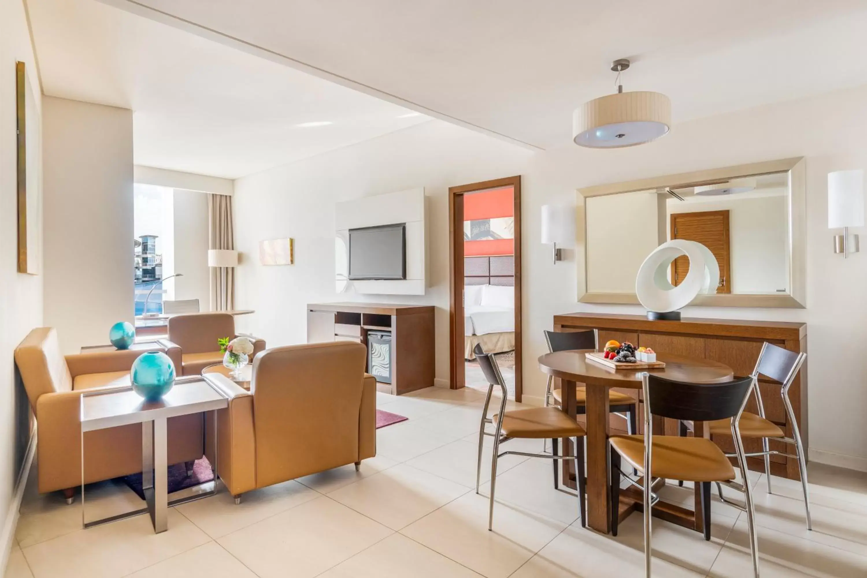 Bedroom, Dining Area in Crowne Plaza Doha - The Business Park, an IHG Hotel