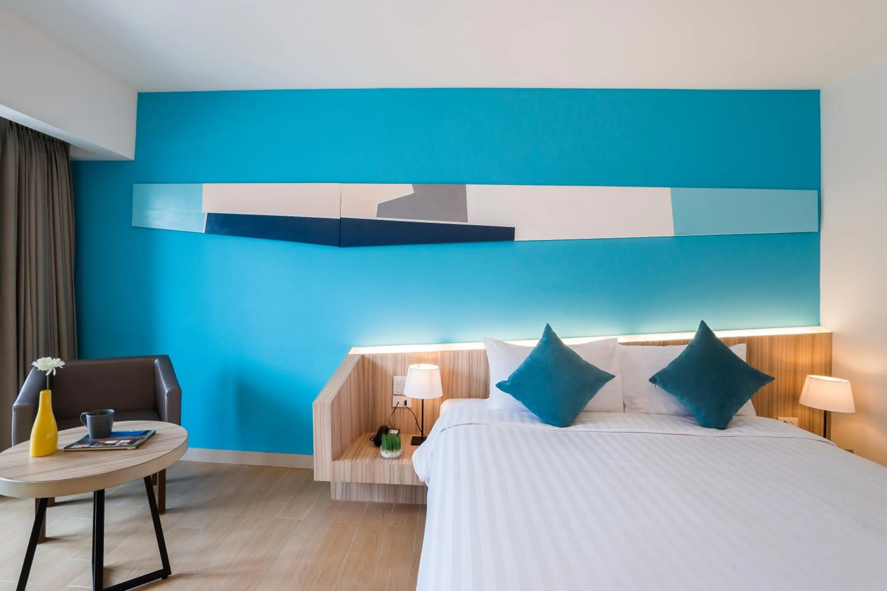 Bed in J Inspired Hotel Pattaya