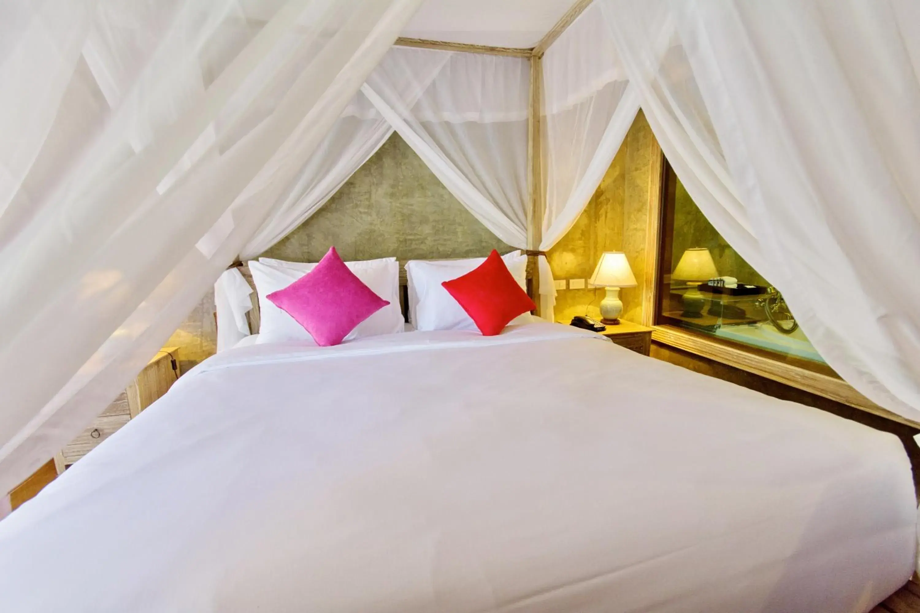 Bed in The Chaya Resort and Spa