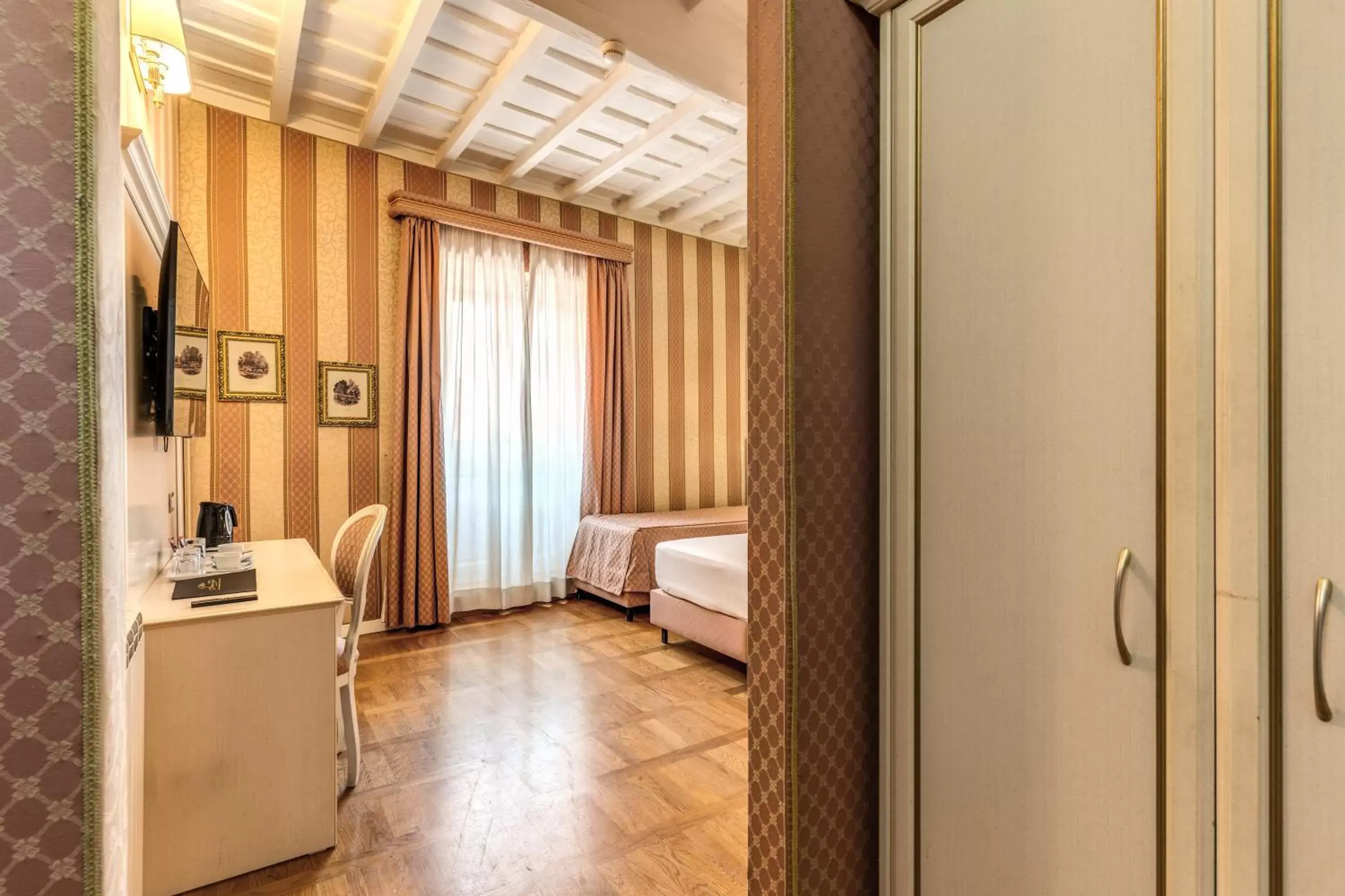 Bedroom in Relais Fontana Di Trevi Hotel
