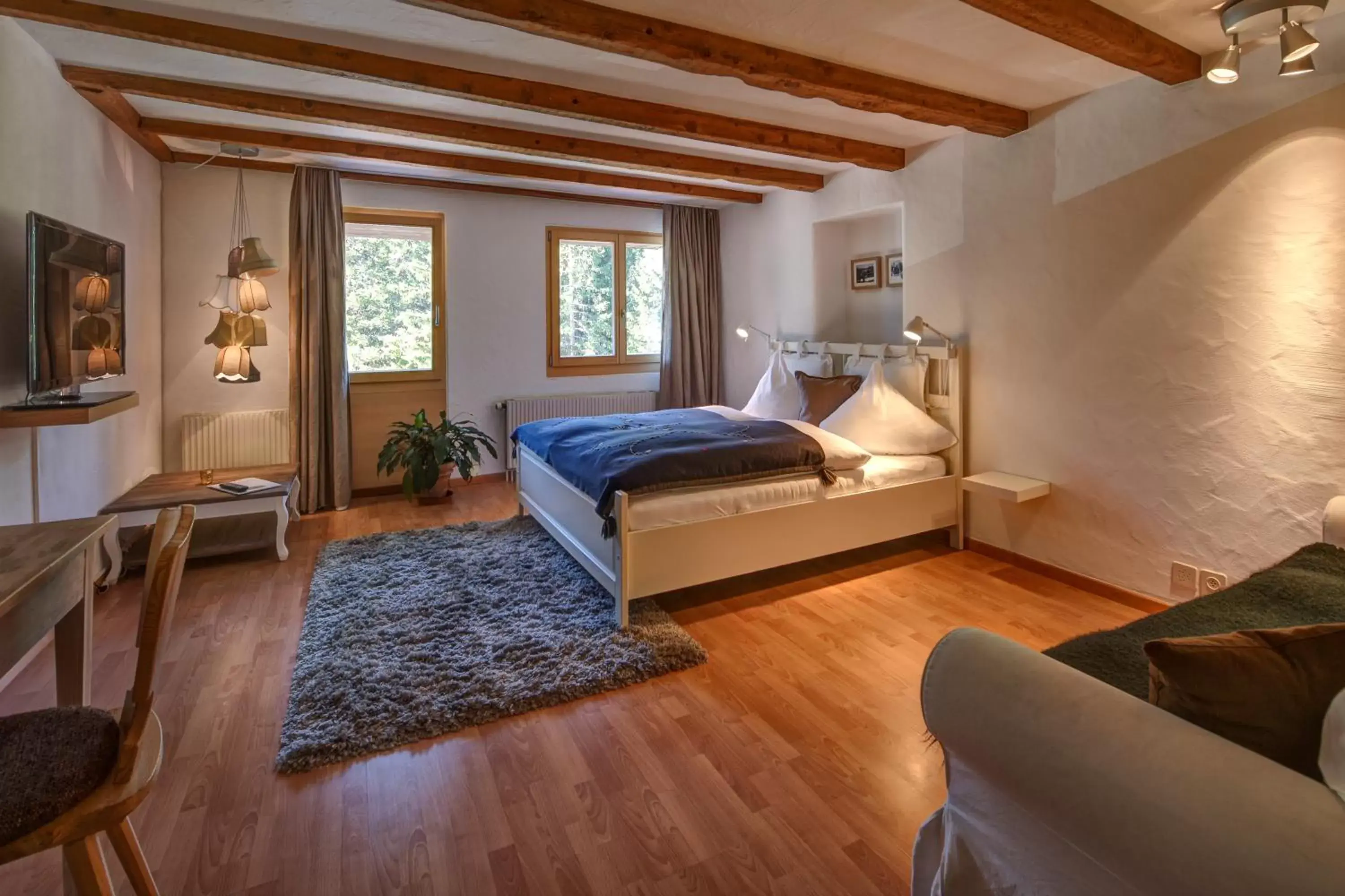 Bed, Seating Area in Hotel Seehof-Arosa