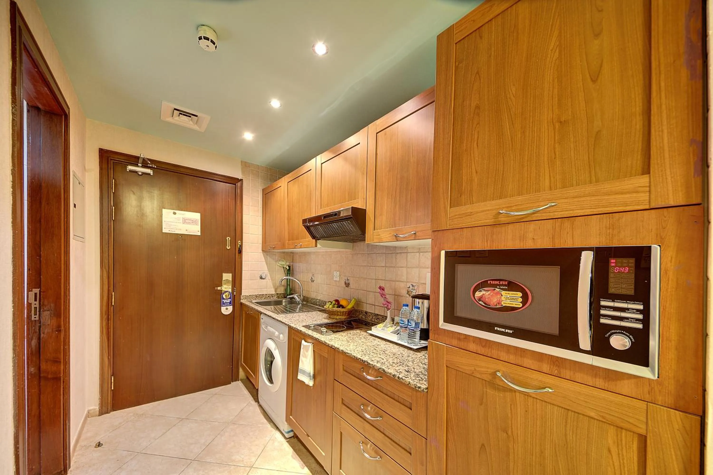 Kitchen or kitchenette in Al Manar Grand Hotel Apartment