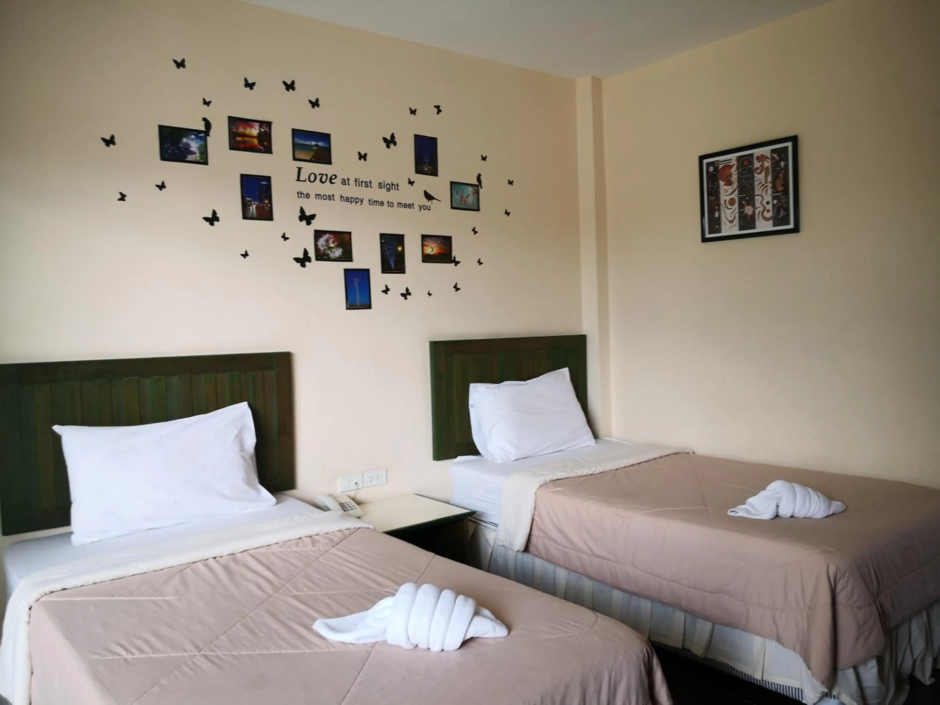 Bed in Baan Suksiri Hotel