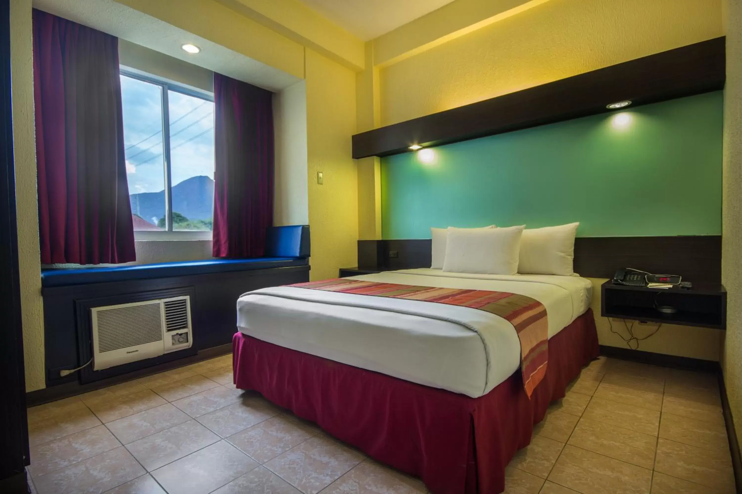 Bed in Microtel by Wyndham Batangas