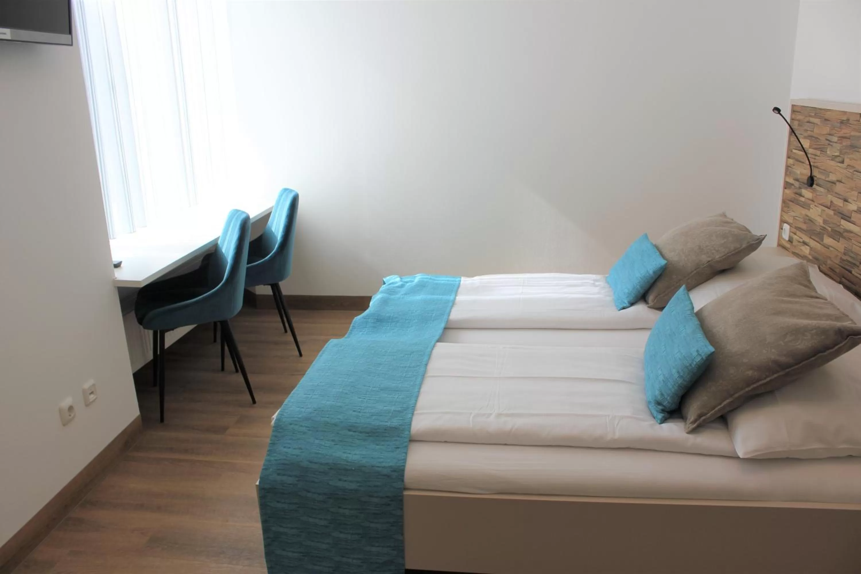 Photo of the whole room, Bed in Am Blumenhaus