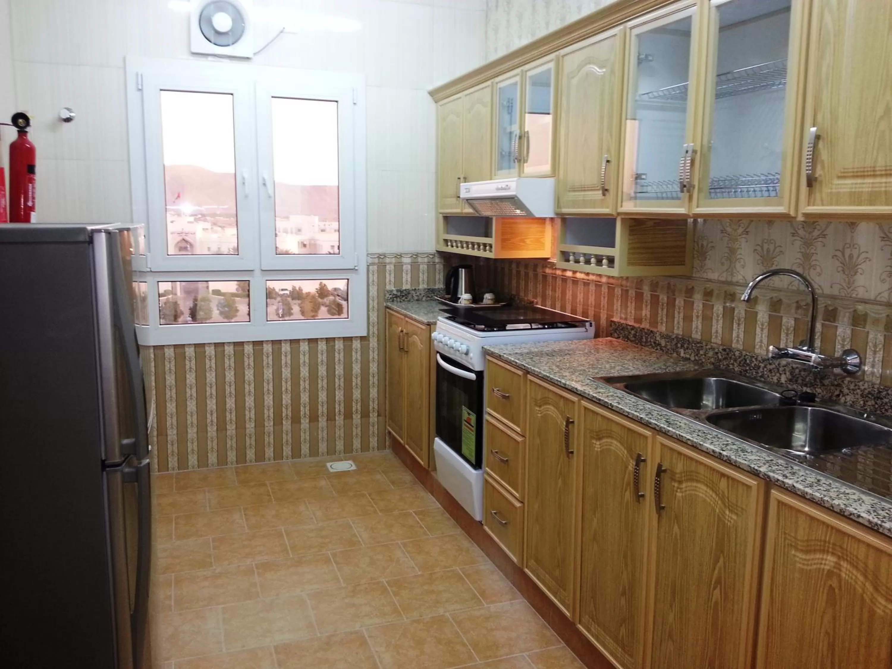Kitchen or kitchenette in Nizwa Hotel Apartments