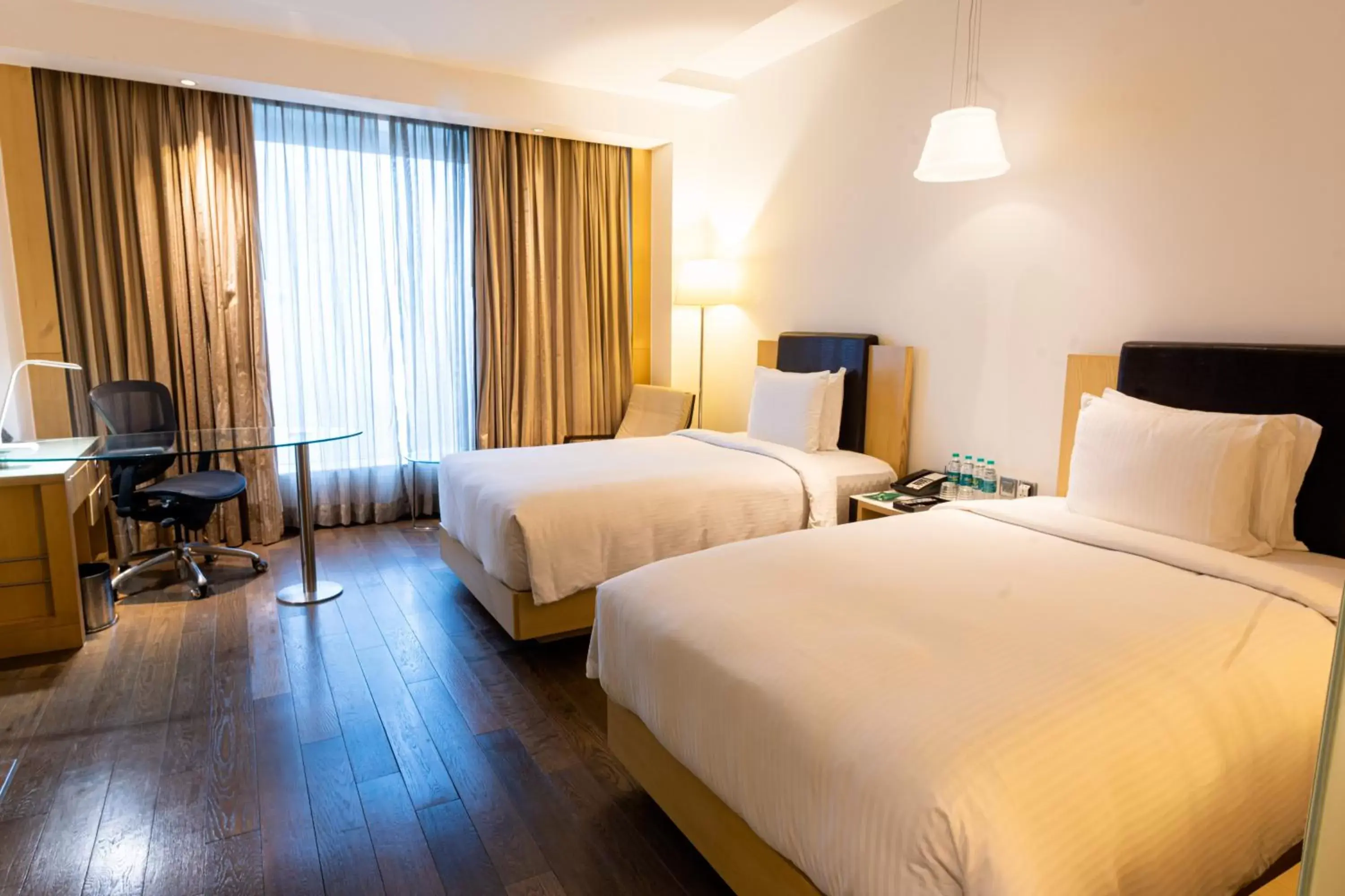 Bed in Crowne Plaza Greater Noida, an IHG Hotel