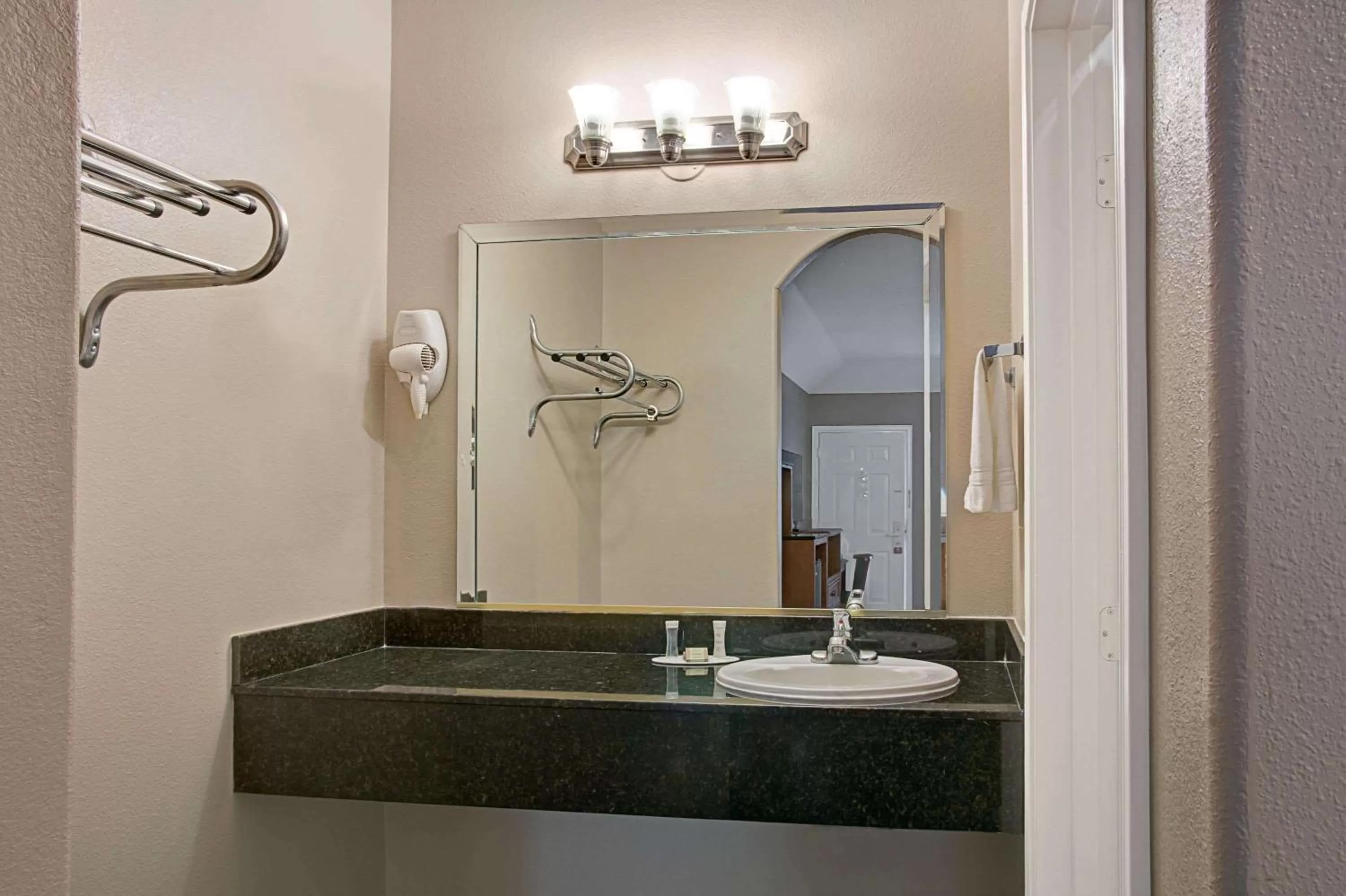 TV and multimedia, Bathroom in Super 8 by Wyndham Montgomery/ Lake Conroe