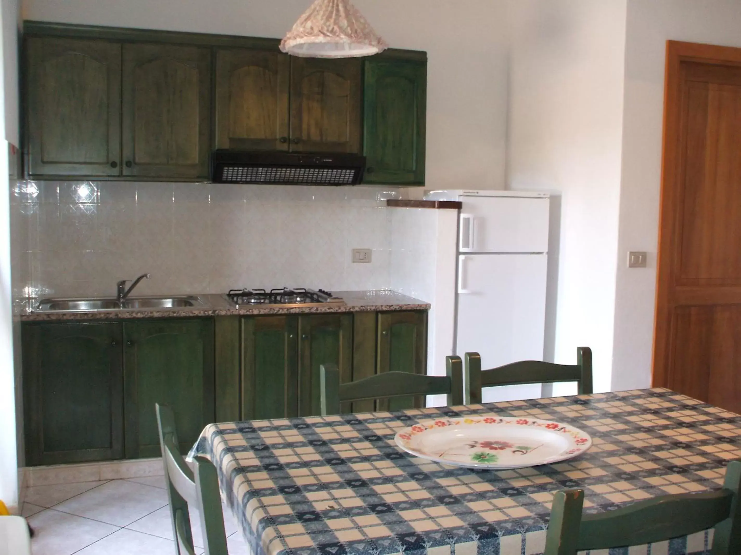 Dining area, Kitchen/Kitchenette in Porto Ottiolu Resort