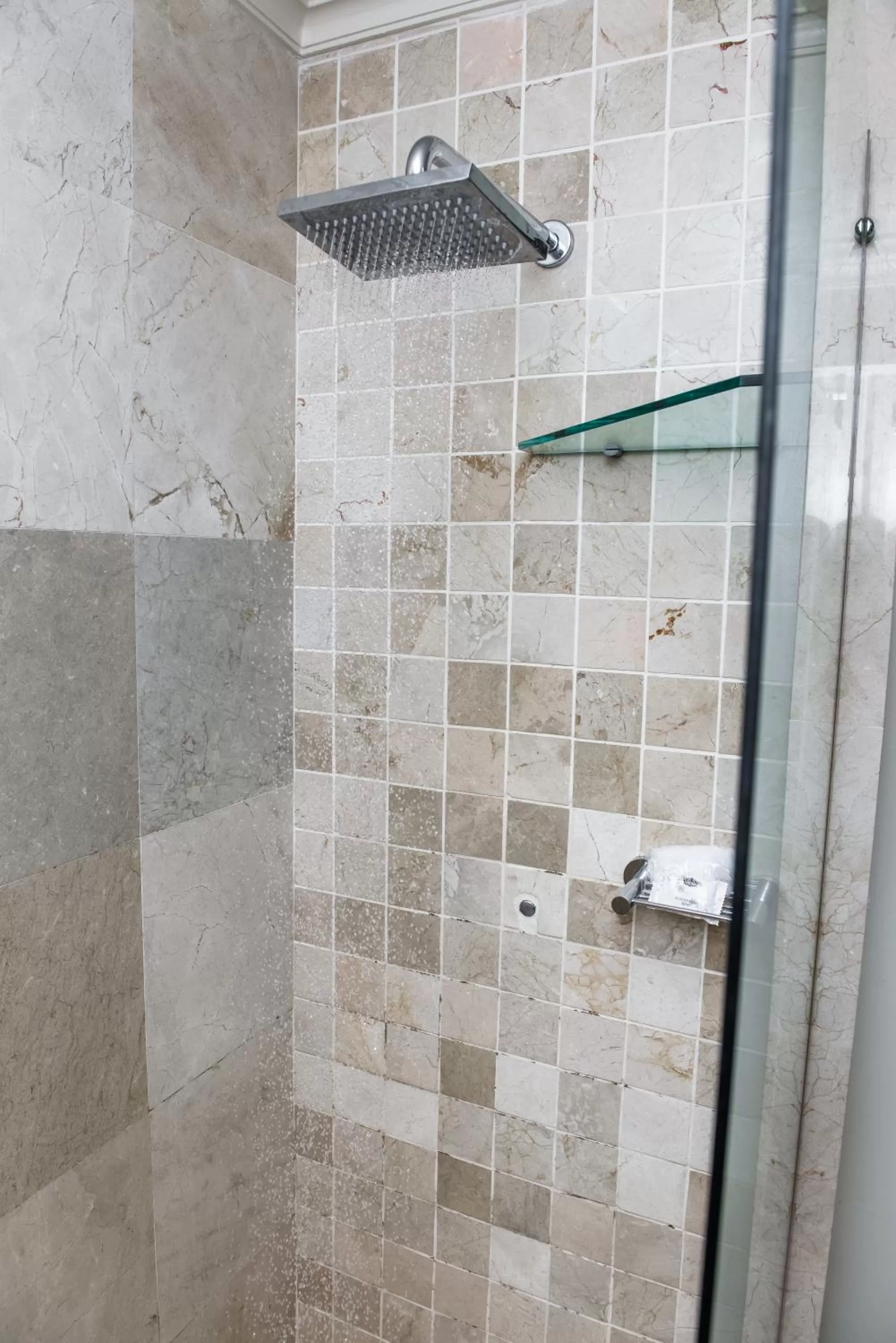 Shower in Belaire Suites Hotel