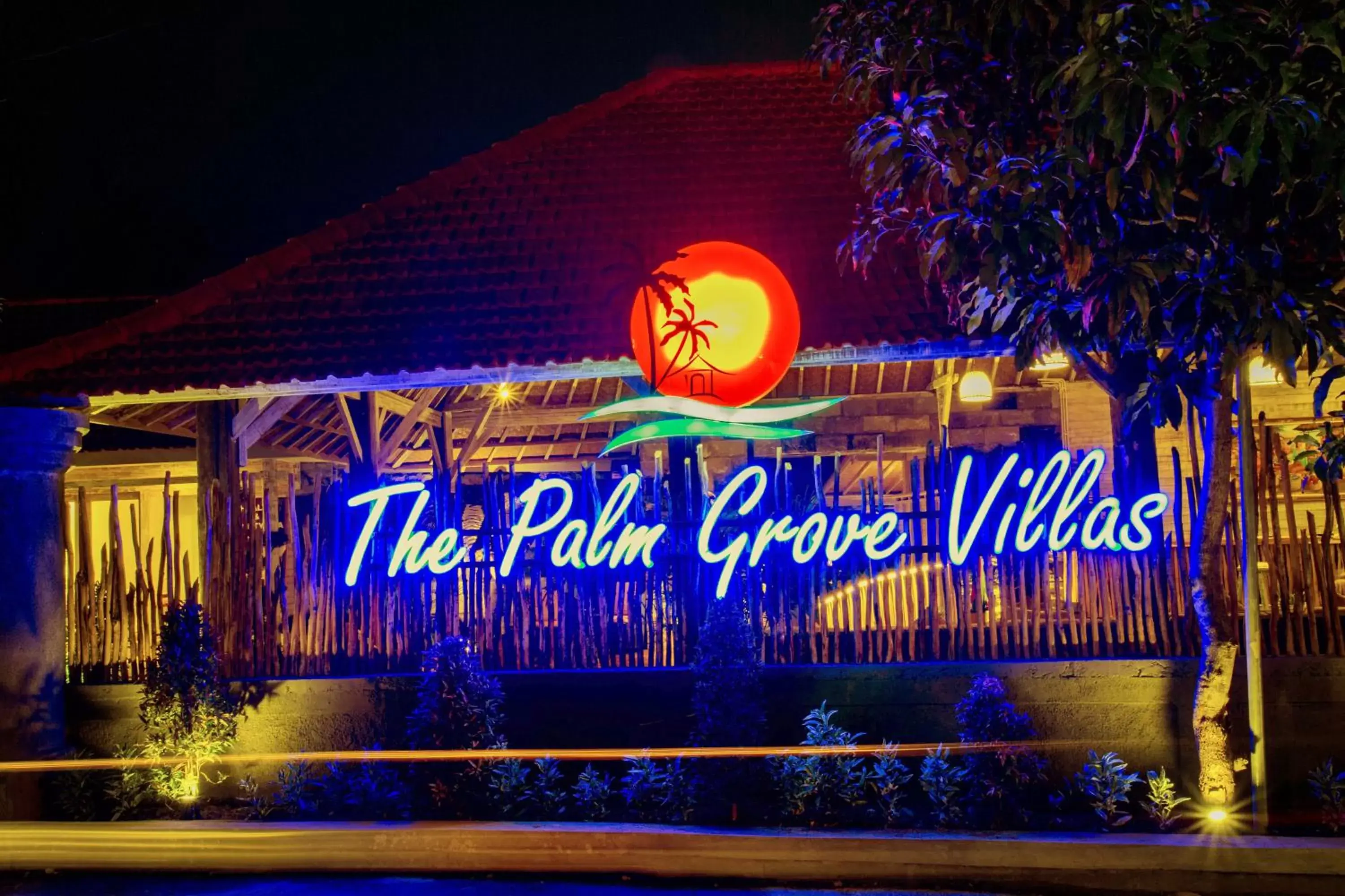 Property logo or sign in The Palm Grove Villas