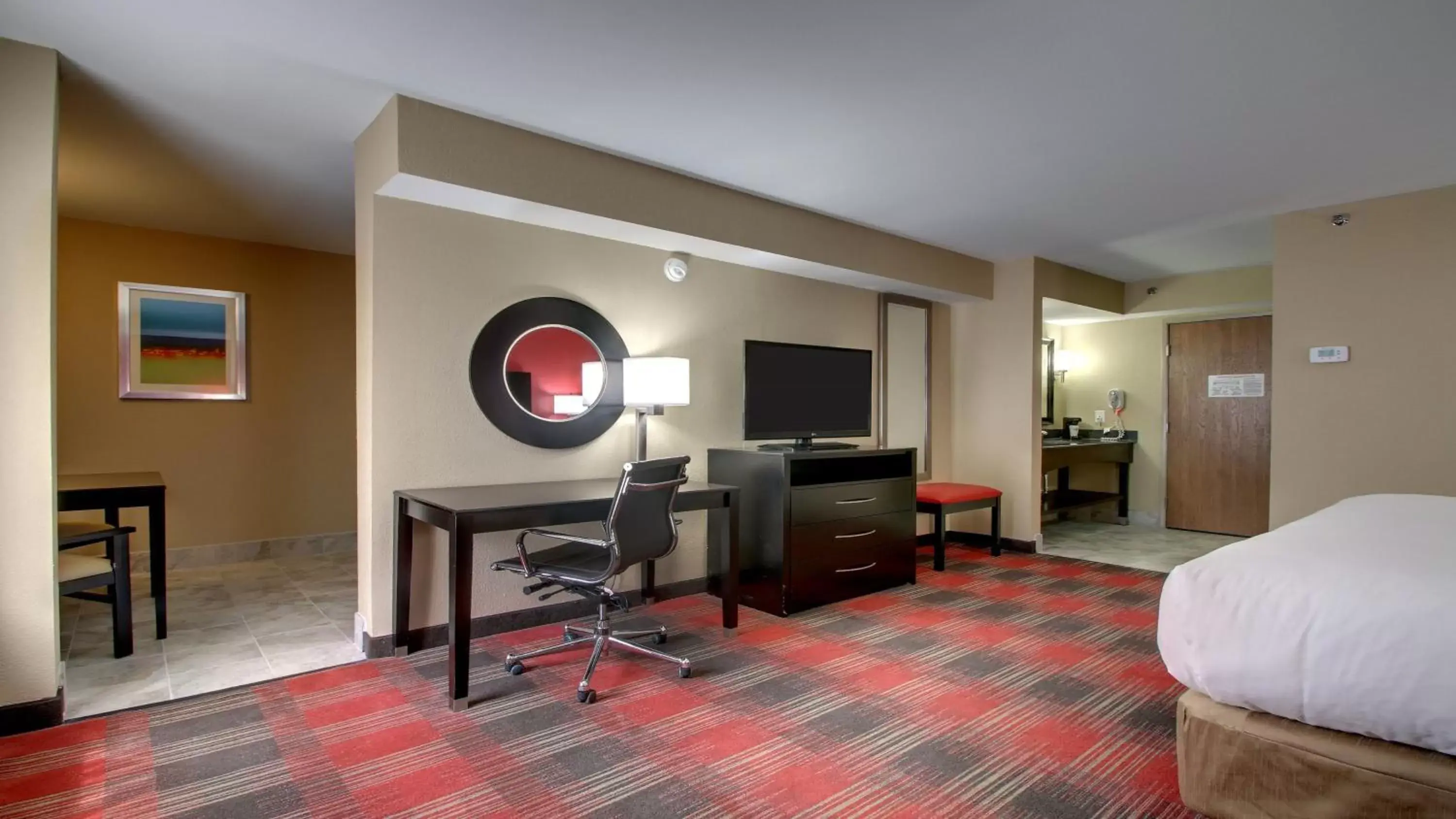 Photo of the whole room, TV/Entertainment Center in Holiday Inn Express & Suites Jackson Downtown - Coliseum, an IHG Hotel