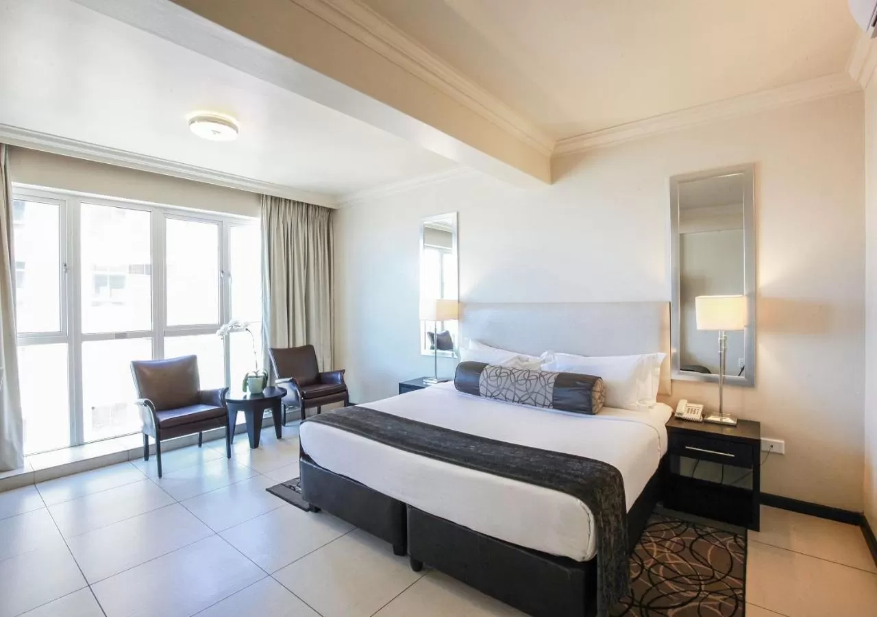 Seating area, Bed in Blue Waters Hotel